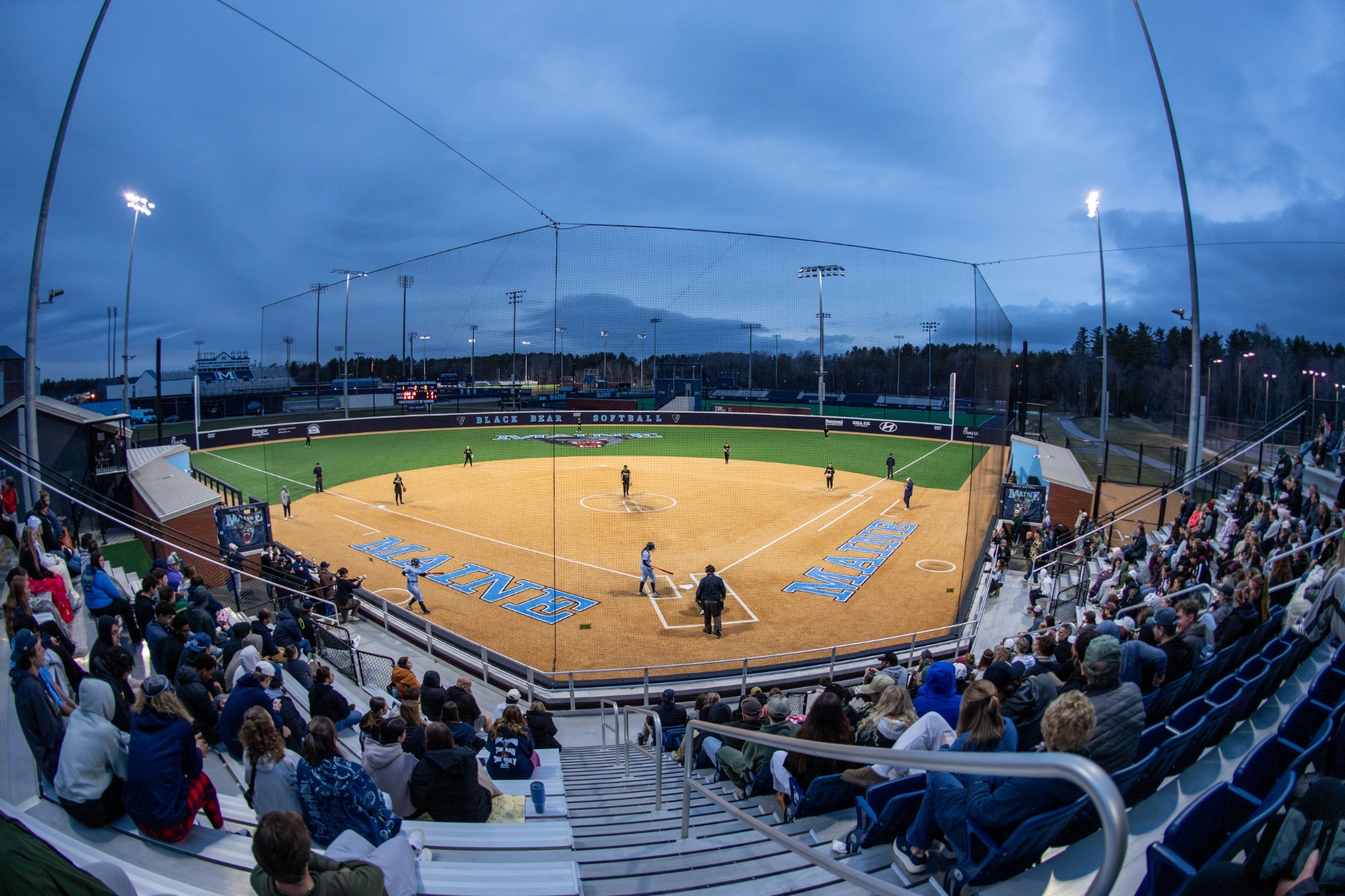 Wide shot of the Pierre & Catherine Labat Softball Complex during a night game.