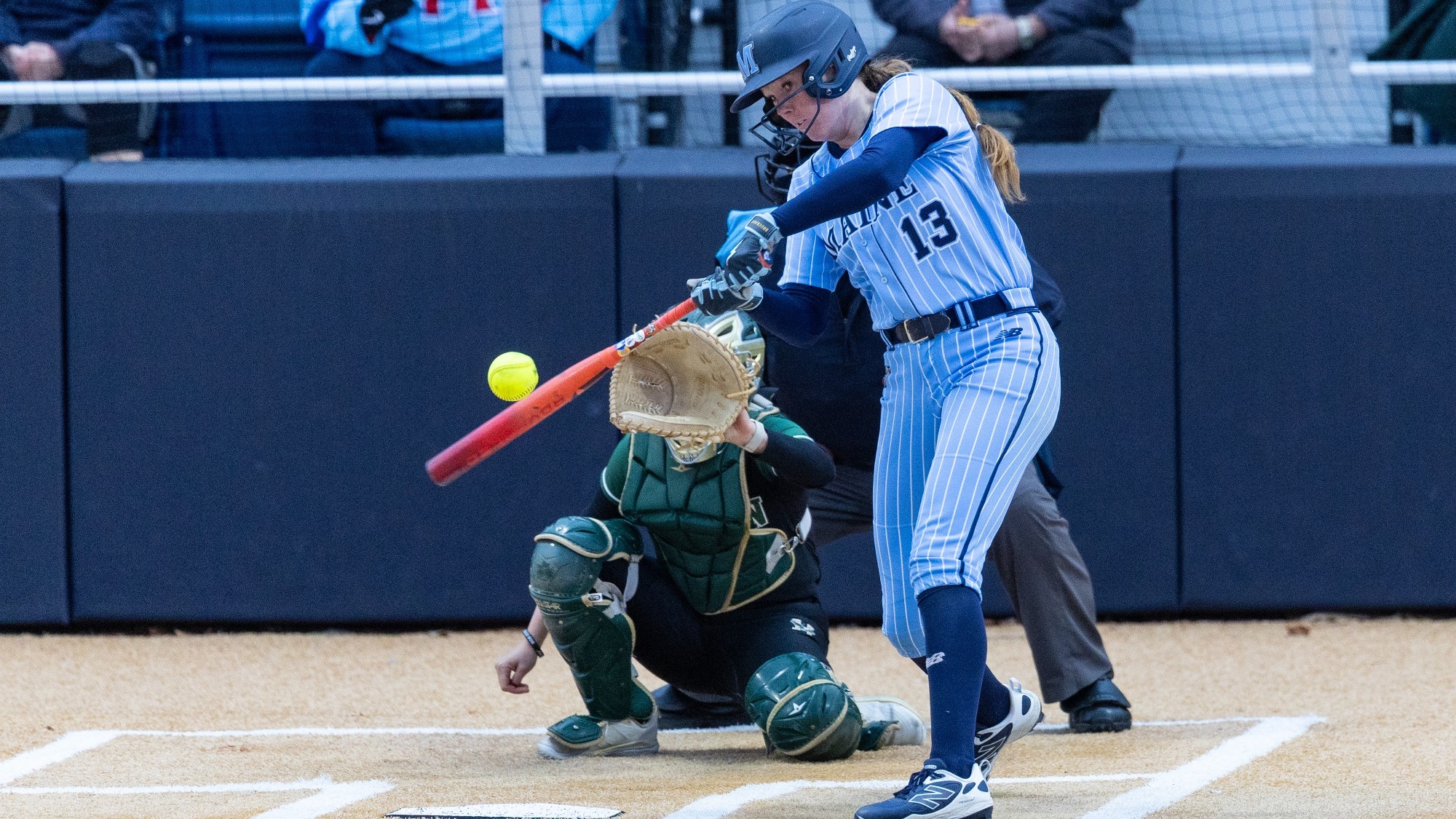 Kaelyn Larkin swings the bat at a pitch.