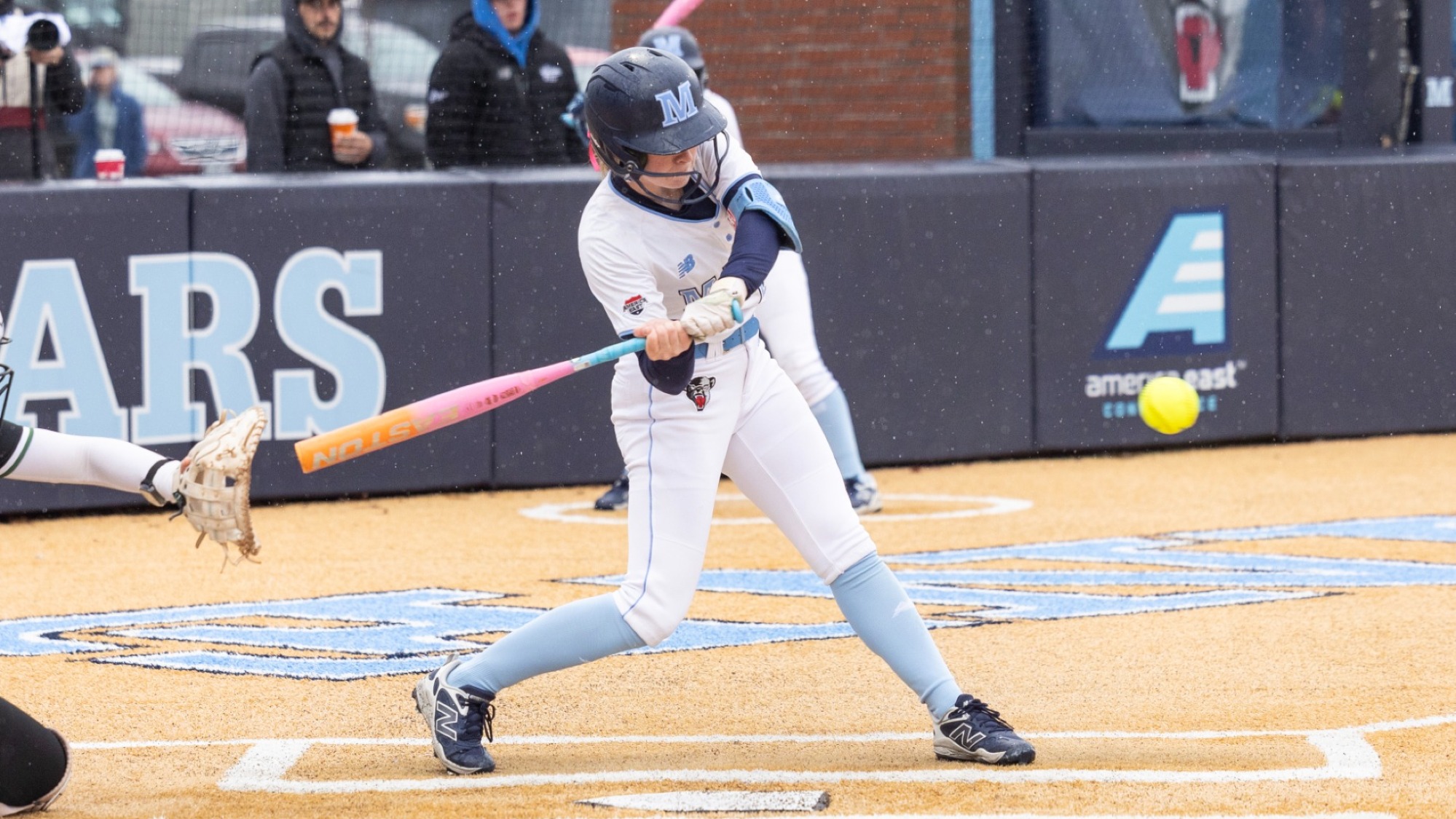 Annika Shearer at bat, swinging at a pitch.