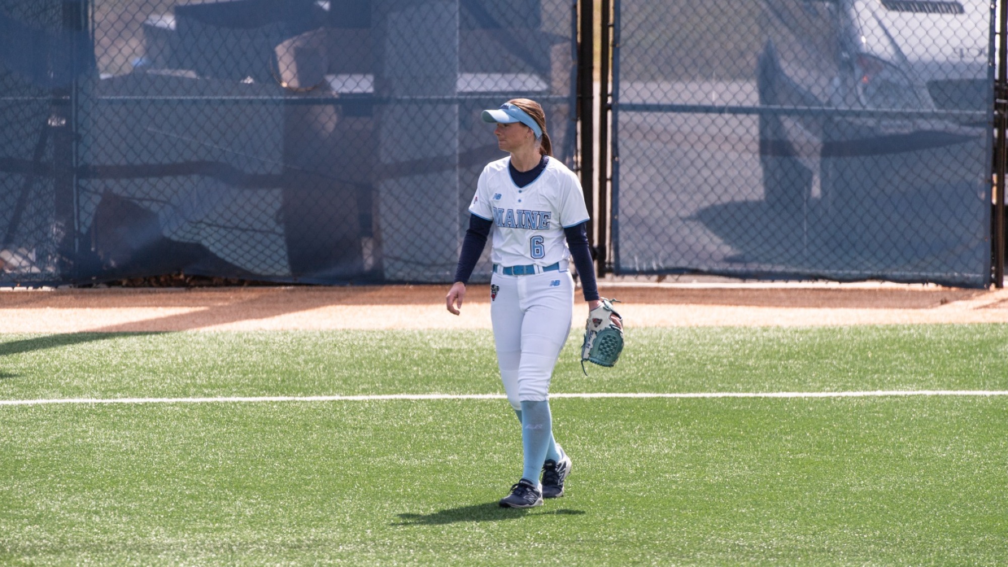 Maggie Helms walks in the outfield.