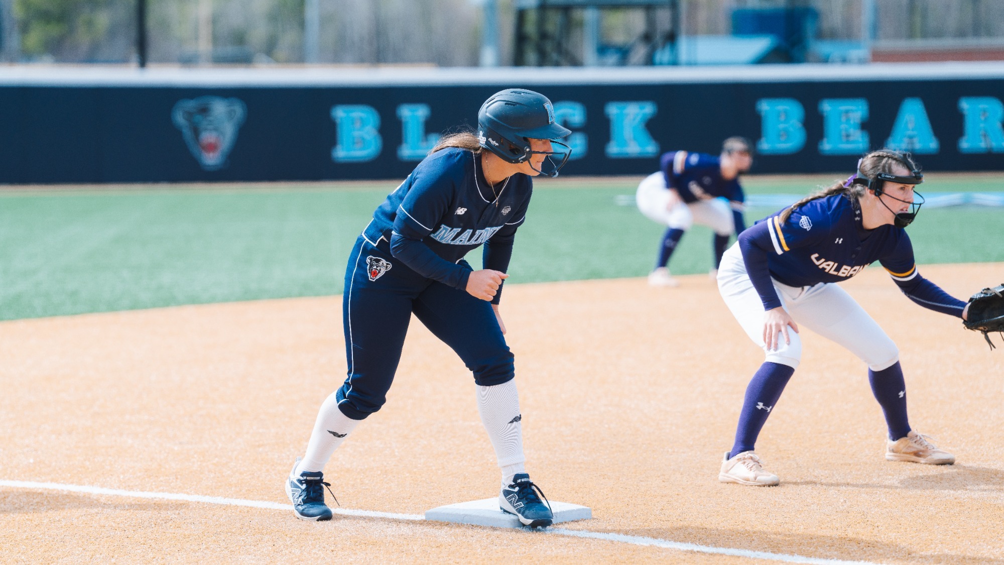 Madison Hand gets ready to run on third base.