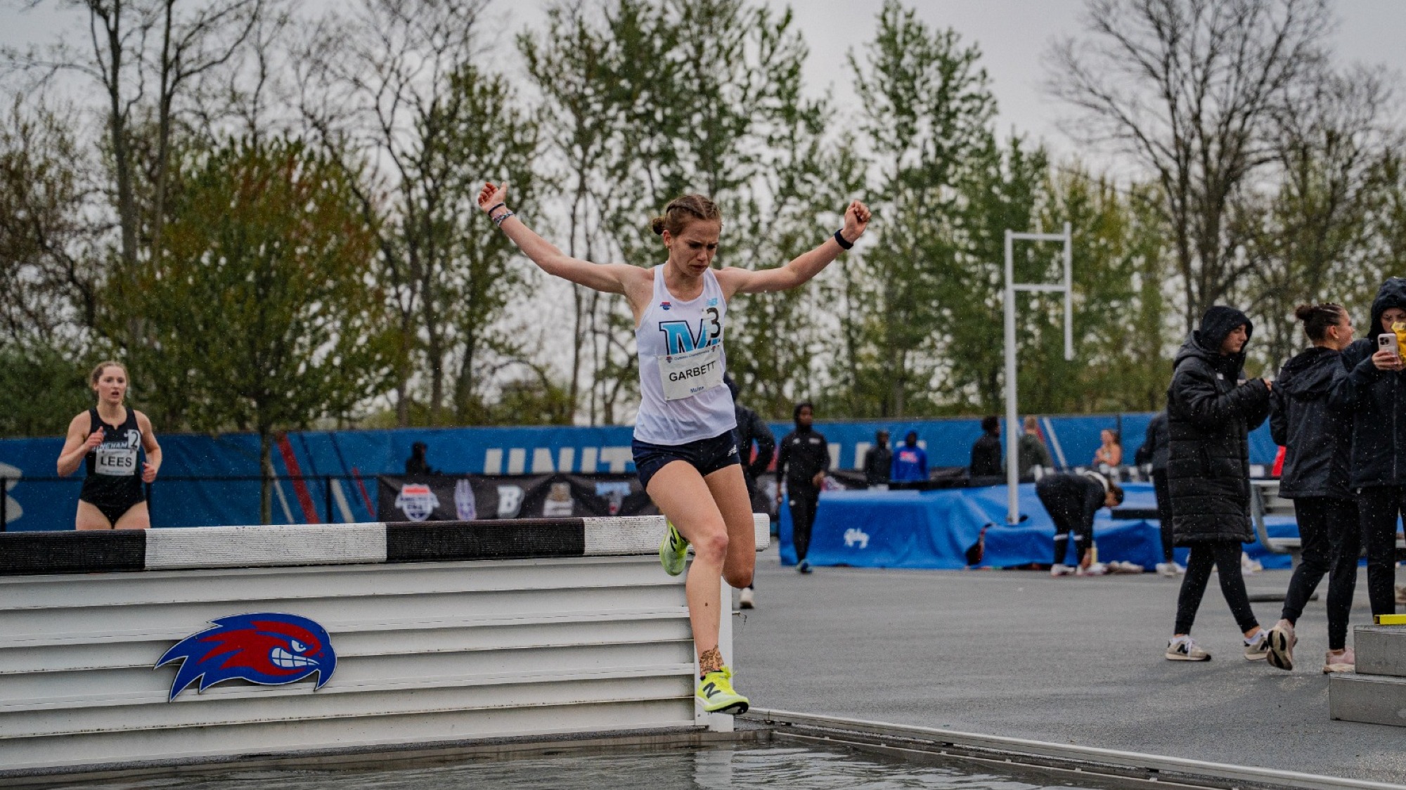 Lila Garbett jumps a hurdle.