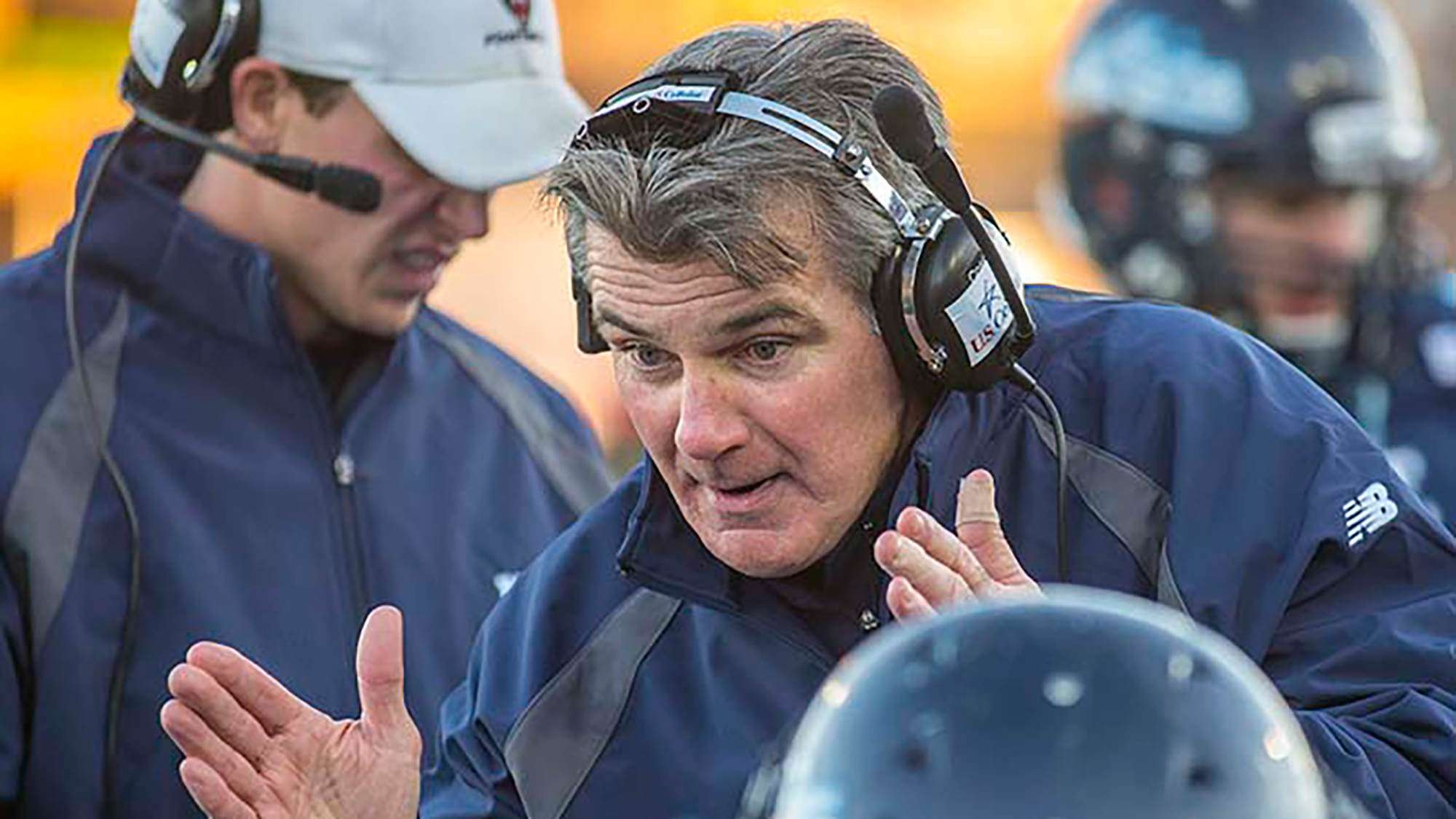Coach Cosgrove addressing the bench during a game. 