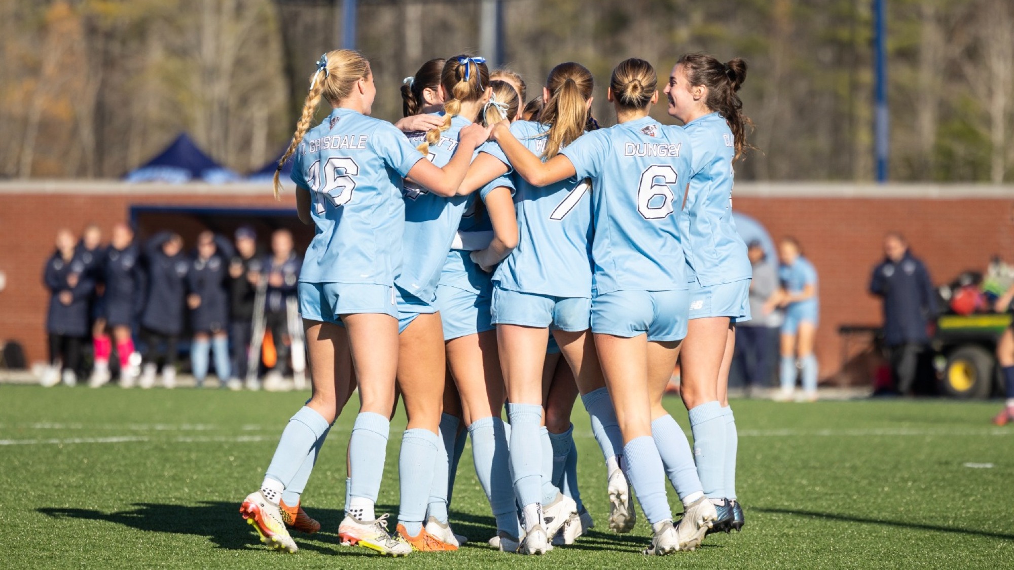 Maine women's soccer celebrates a goal.