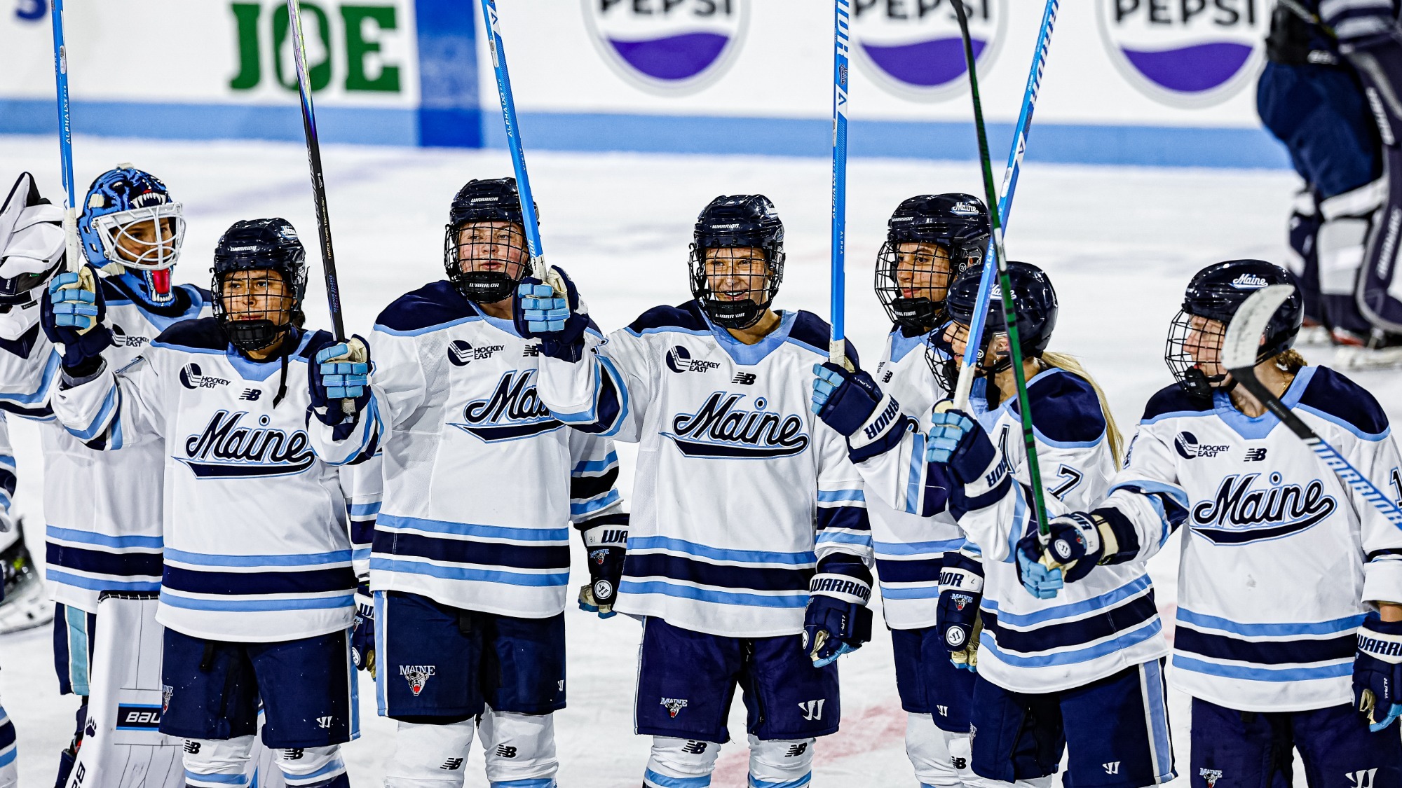 Maine women's hockey salutes the crowd postgame.