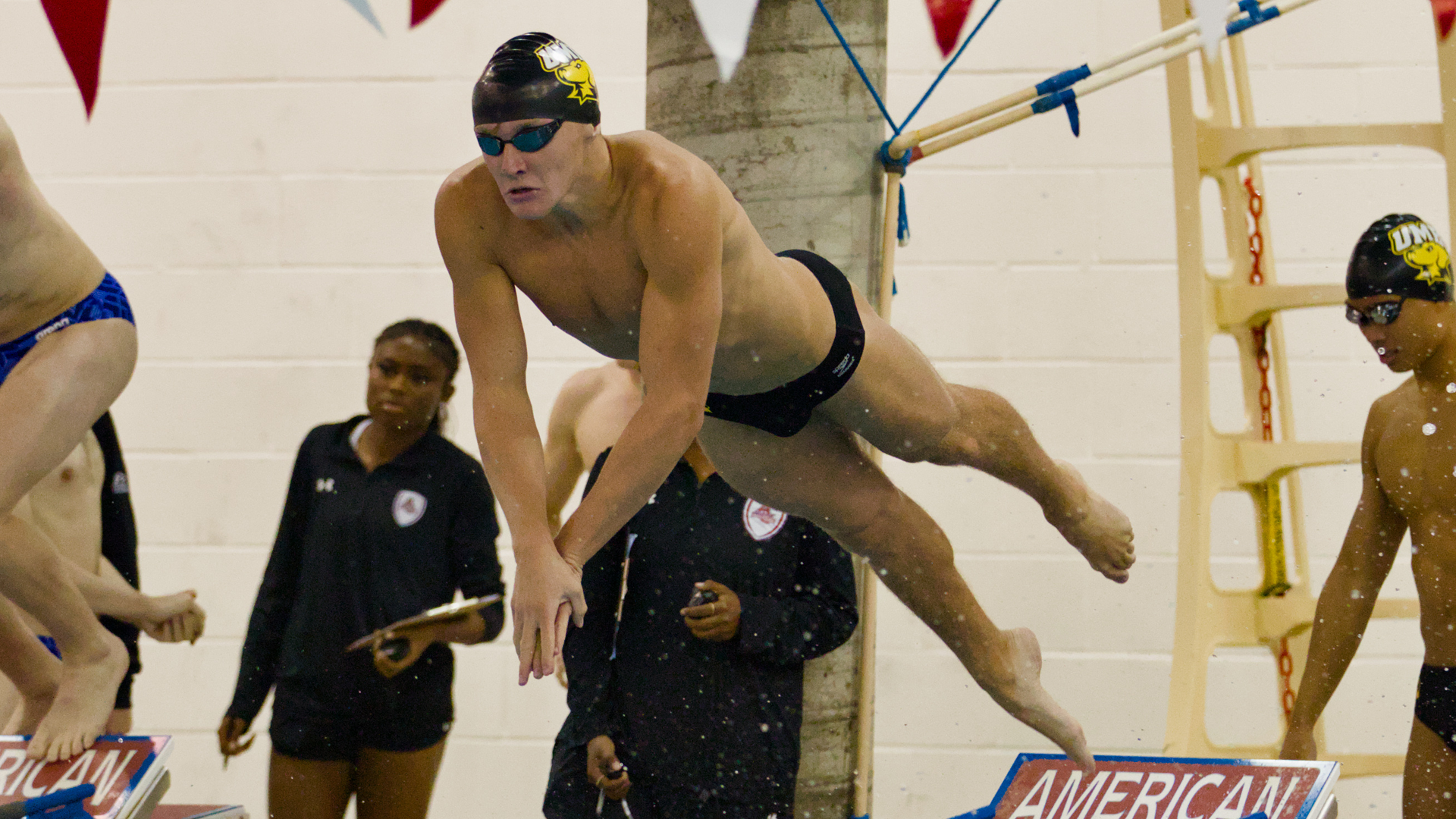 Braden Weise dives into the pool at American