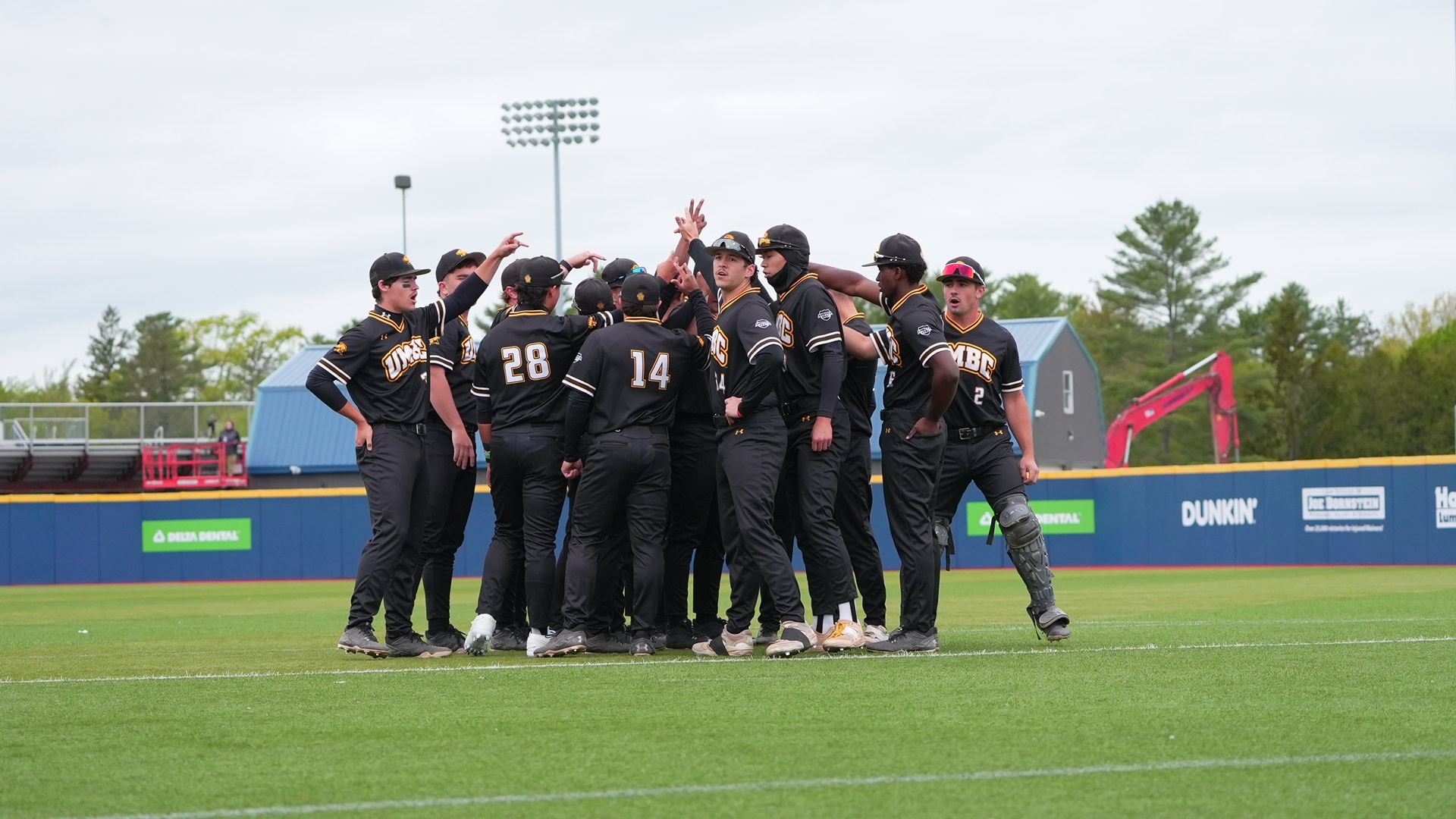 UMBC huddles prior to its America East Playoff game at Maine