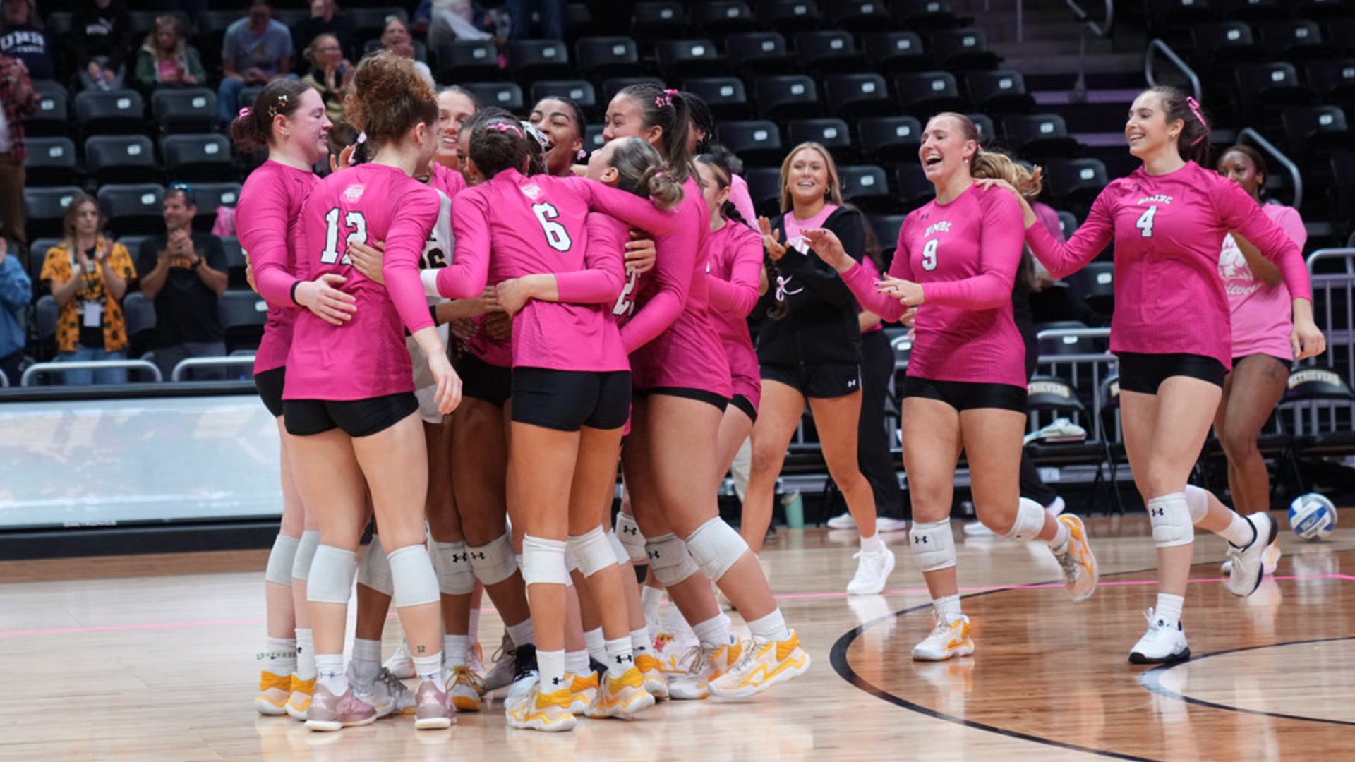 UMBC Celebrates winning over UNH