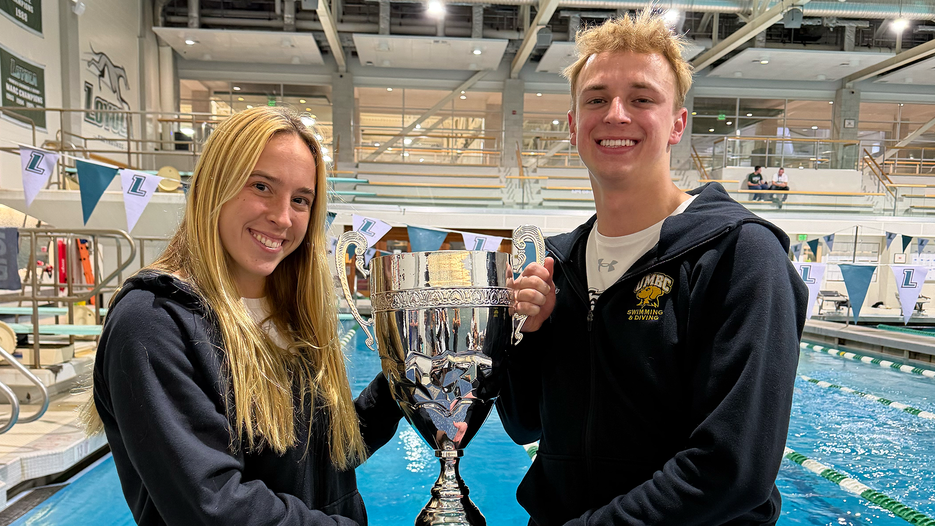 Ember Stennett and Anders Logas hold their Divers of the Meet Trophy