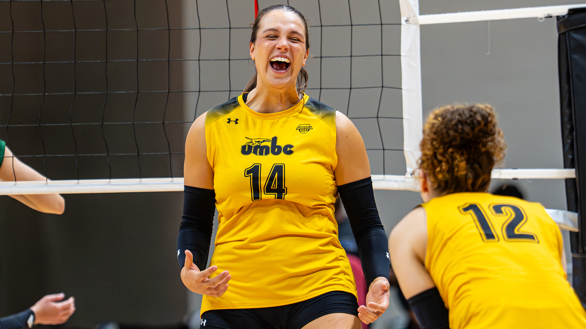Claudia Llamas Celebrates a kill against George Mason