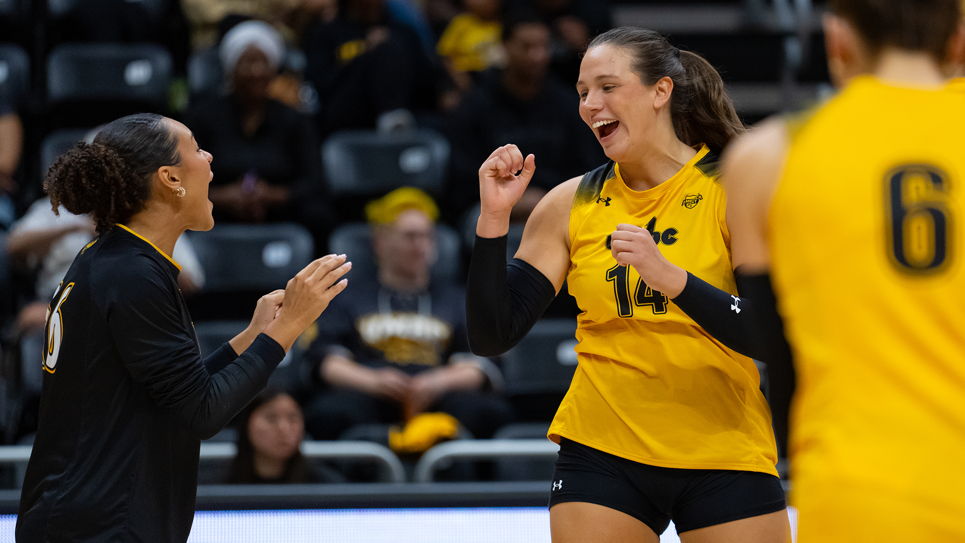 Hannah Howard and Claudia Llamas celebrate a point against George Mason