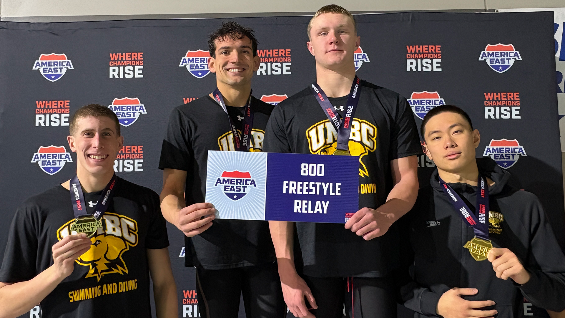 Tyler Kay, Andrew McEachern, Braden Weise and Matthew So pose with their medals