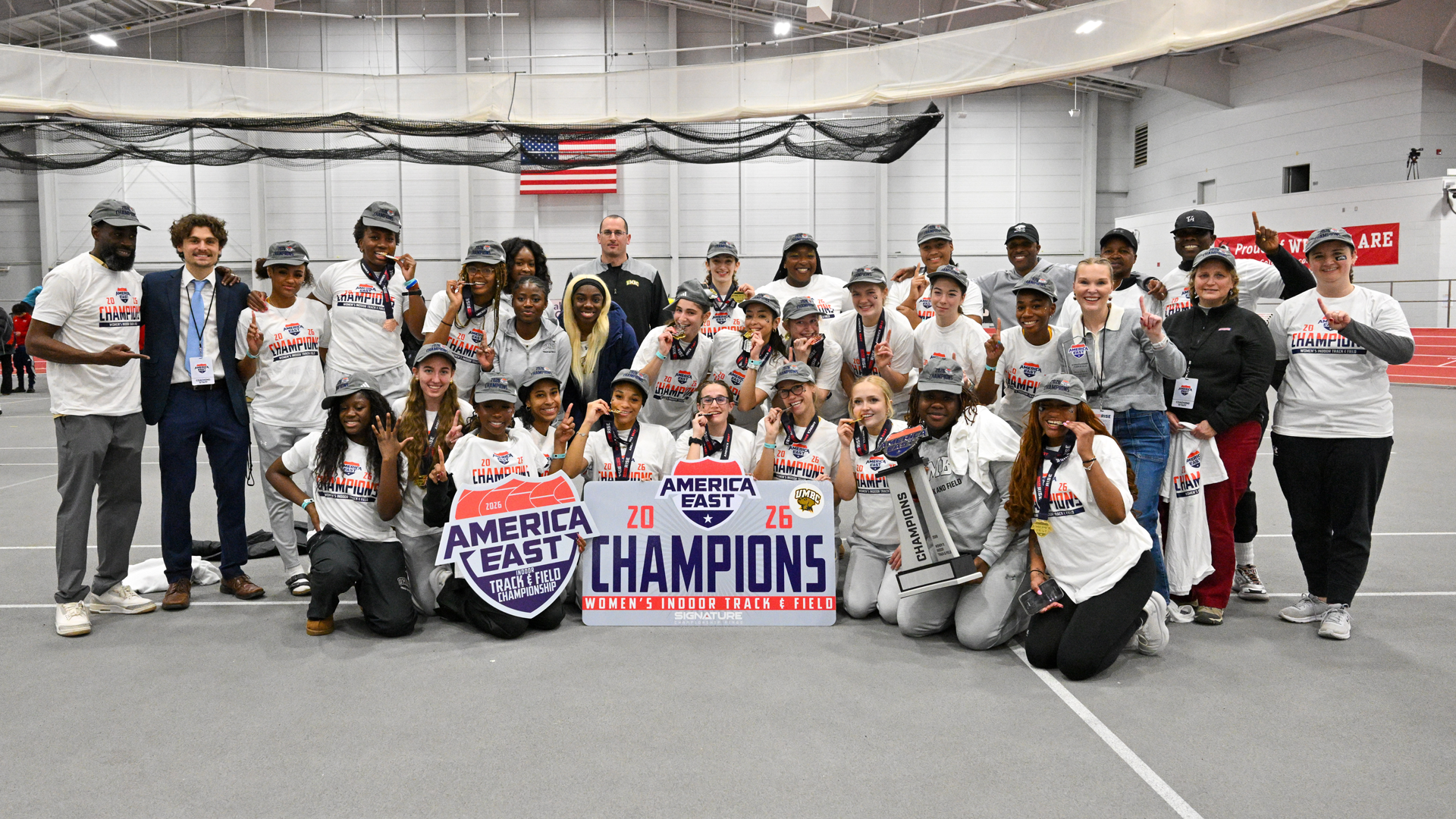 The UMBC Women''s Indoor Track & Field team celebrates their America East Championship