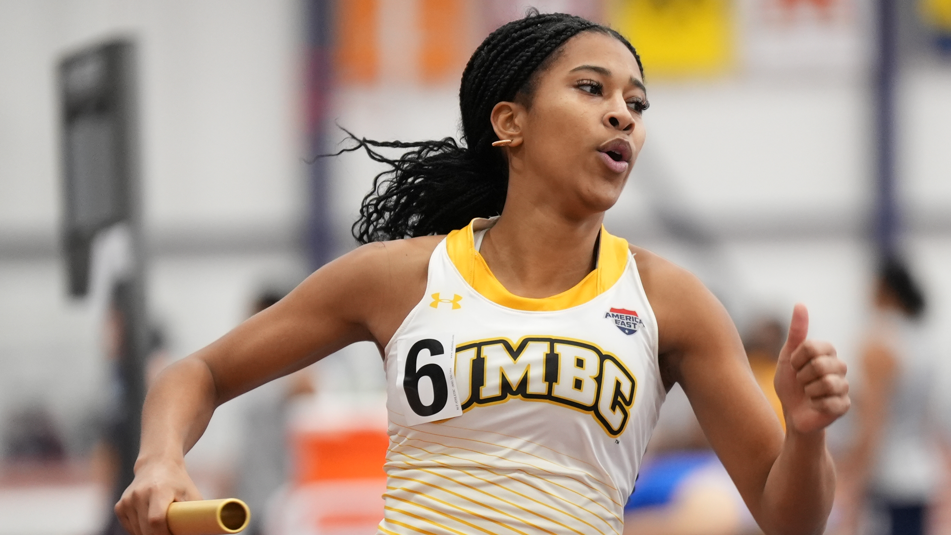 Jayda Solomon runs in a relay at Penn State
