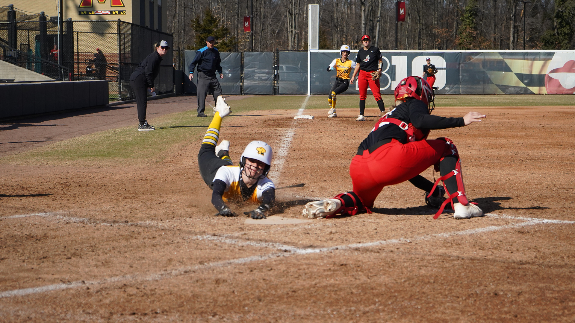 Ella Squaires slides into home against Fairfield