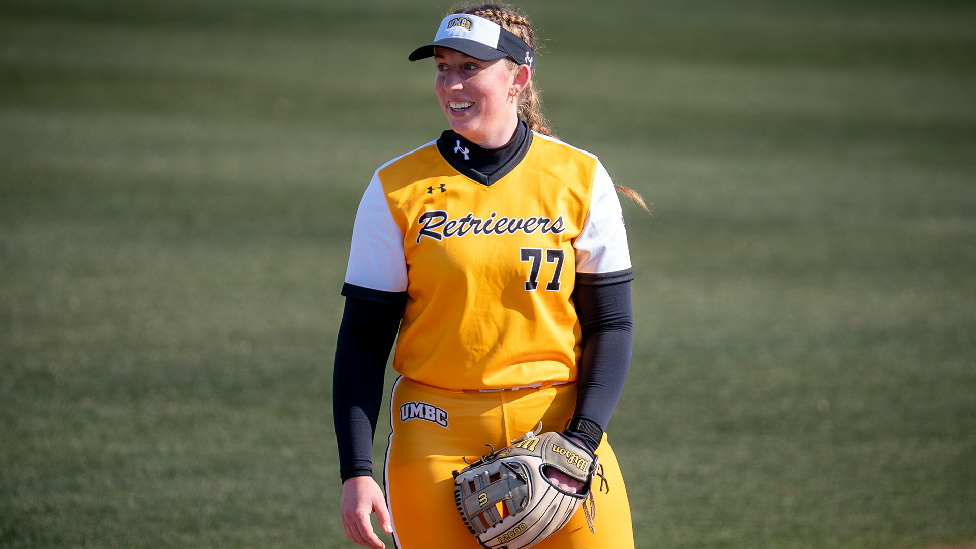 Emily Riggs smiles while playing third base at Wofford