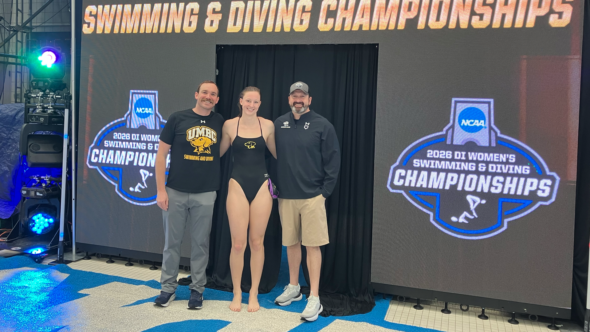 Ashley Gutshall and the coaching staff pose at NCAA Championships