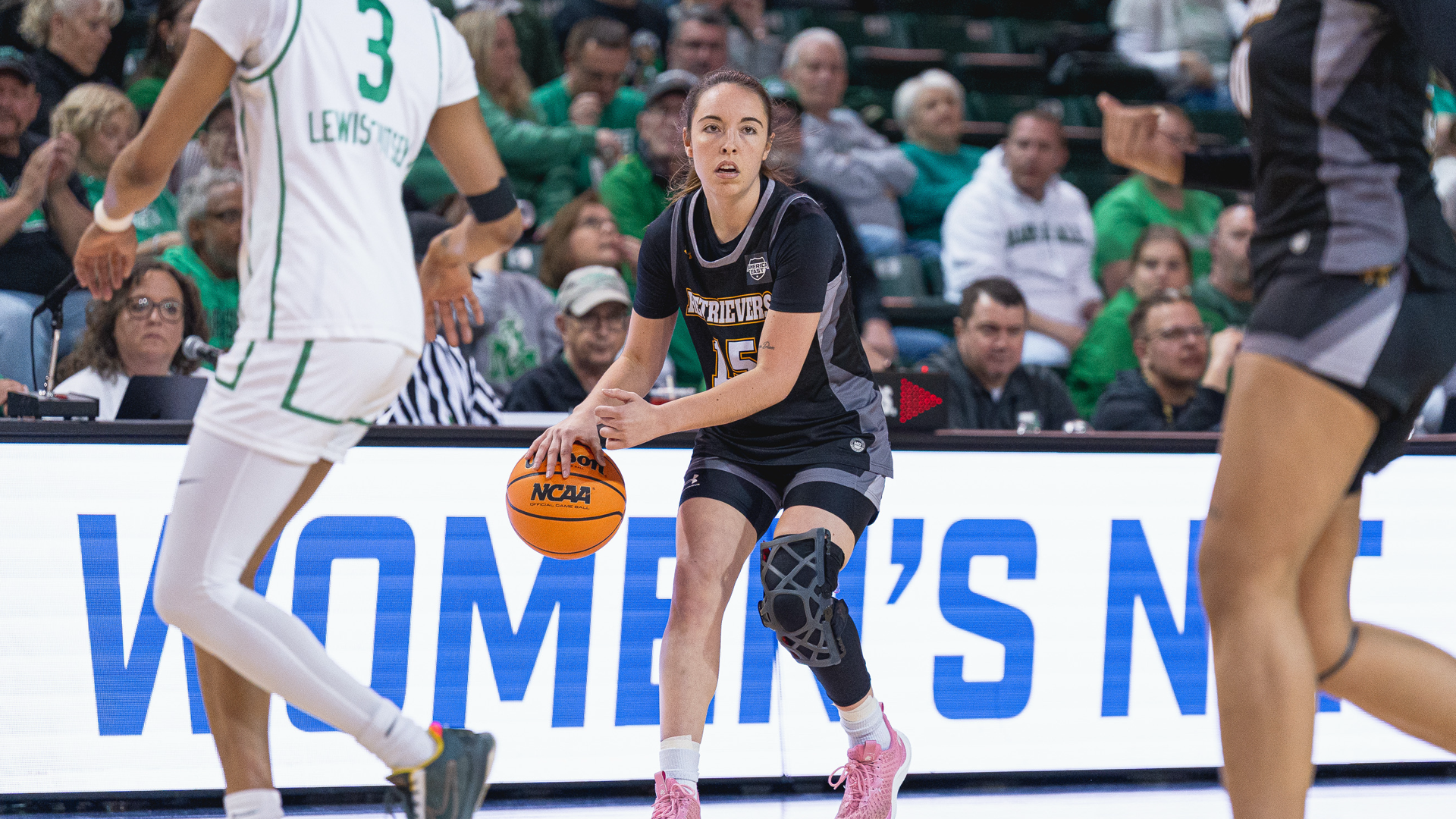 Carmen Yanez dribbles at Marshall in the WNIT