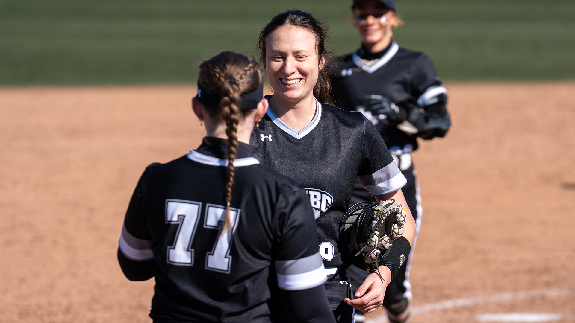 Maggie Frisvold celebrates after an inning