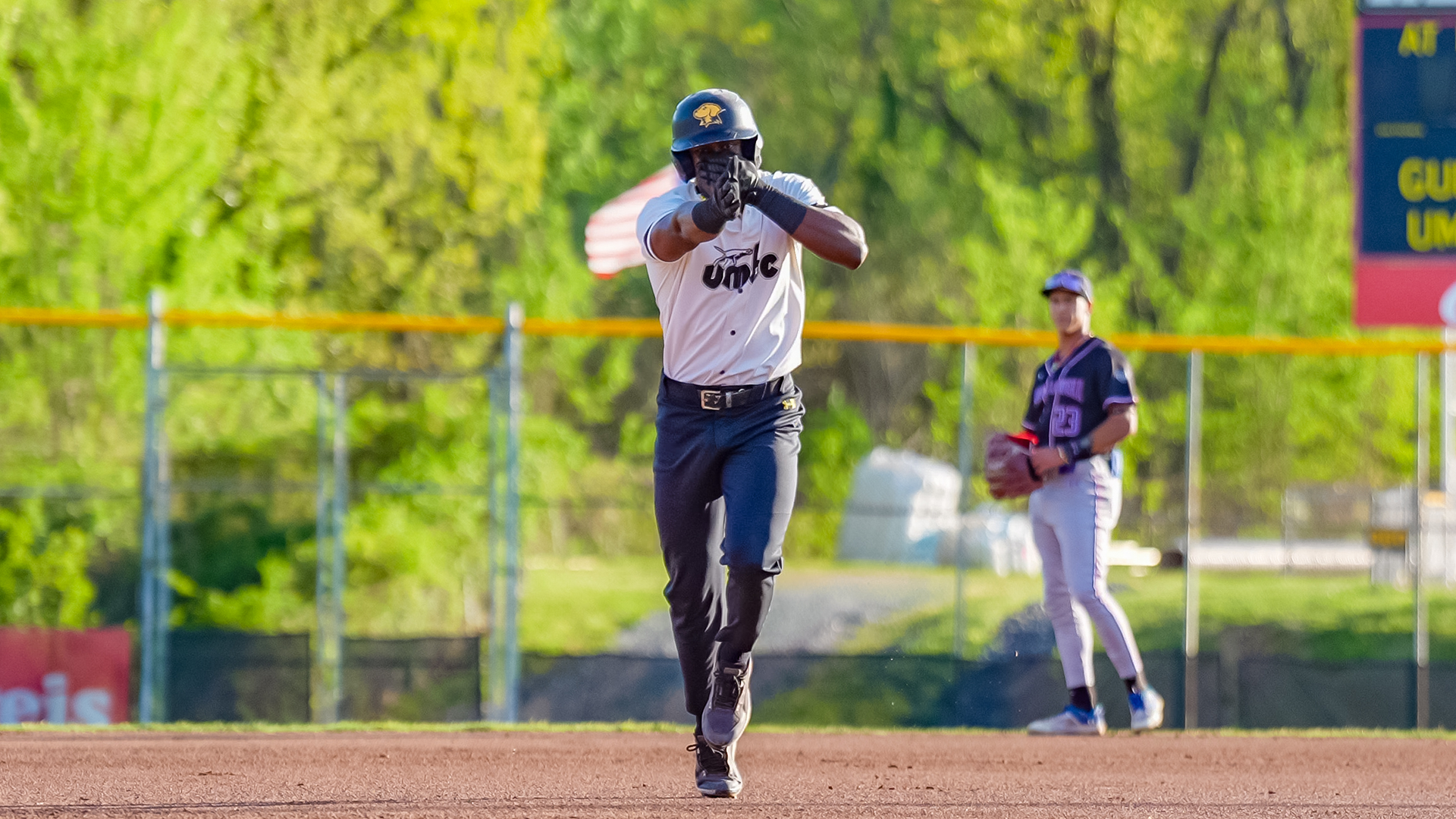 Ehi Okojie celebrates a homer as he gets ready to round third