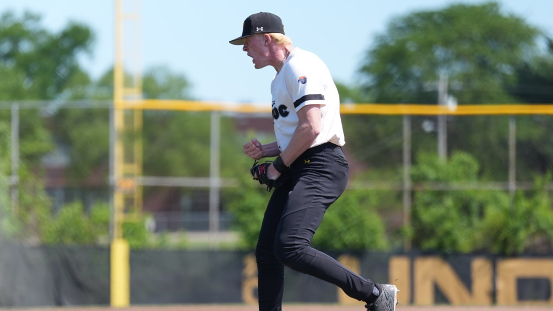 Kailen Hackmann screams in celebration after a strikeout to end an inning