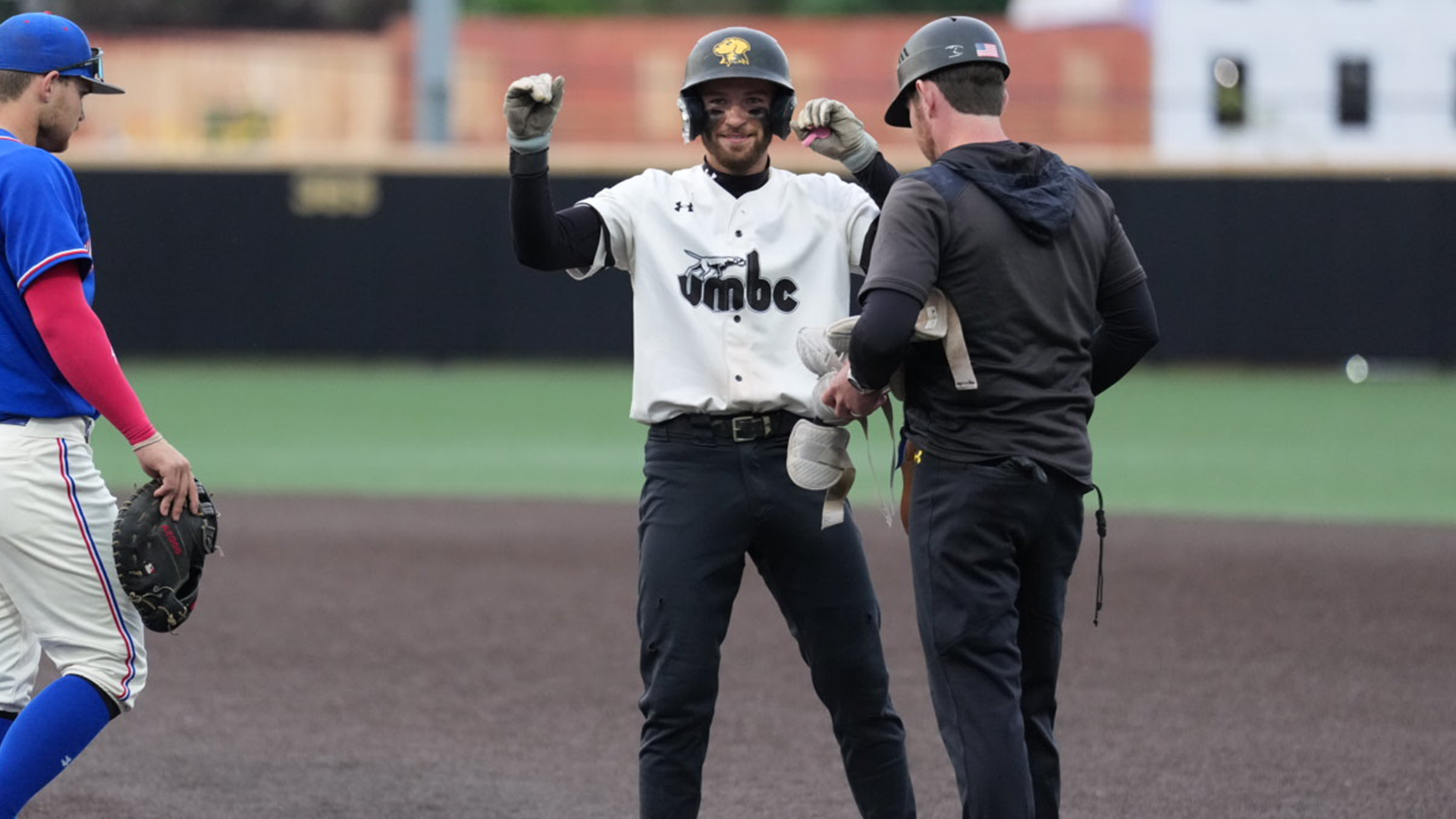 Dylan Melton celebrates a single against UMass Lowell in the AE Tournament at Binghamton