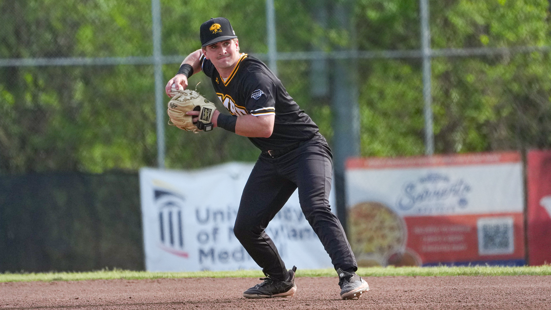 Brooks Henderson throws the ball to first against UMass Lowell