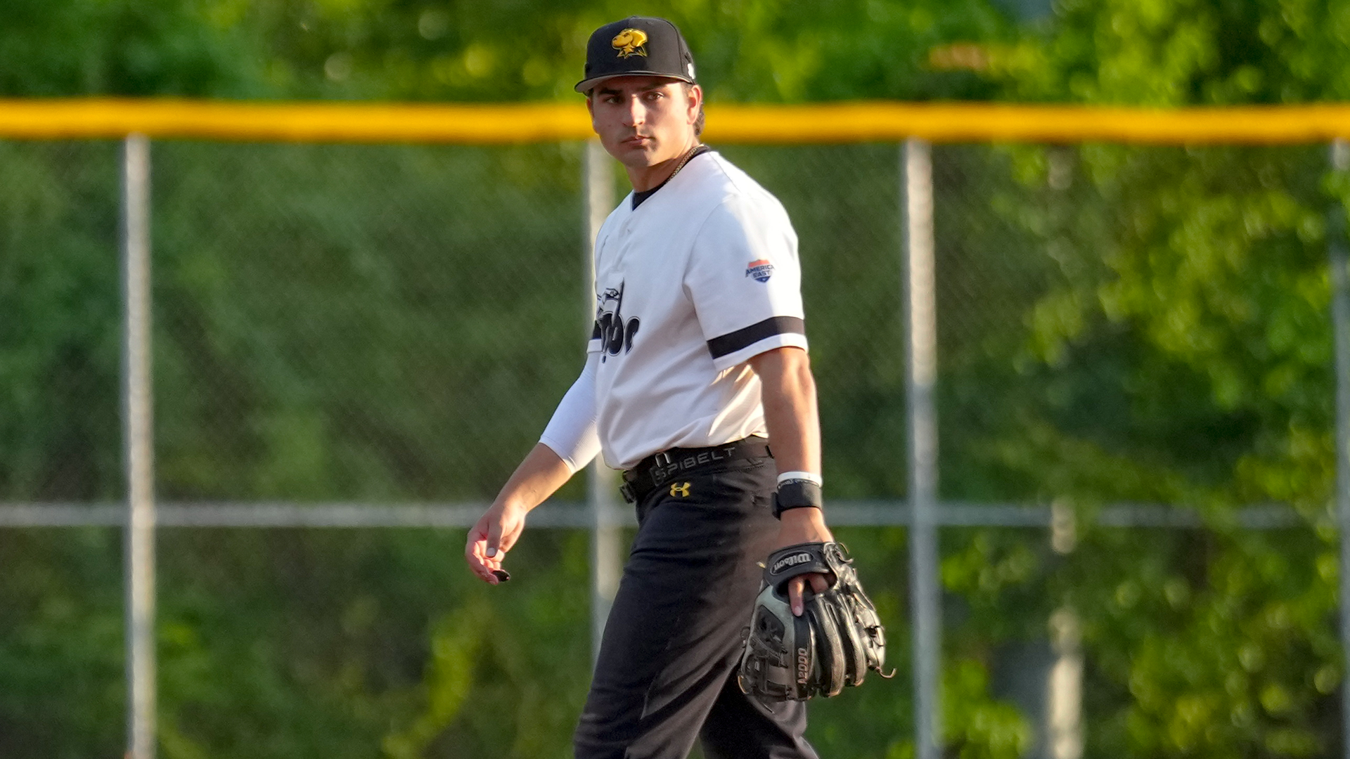 Joe Lomangino looks on during warmups in the field against Coppin State