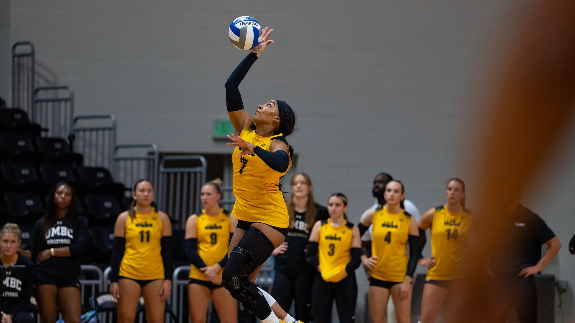 Natalie Harris serves against George Mason