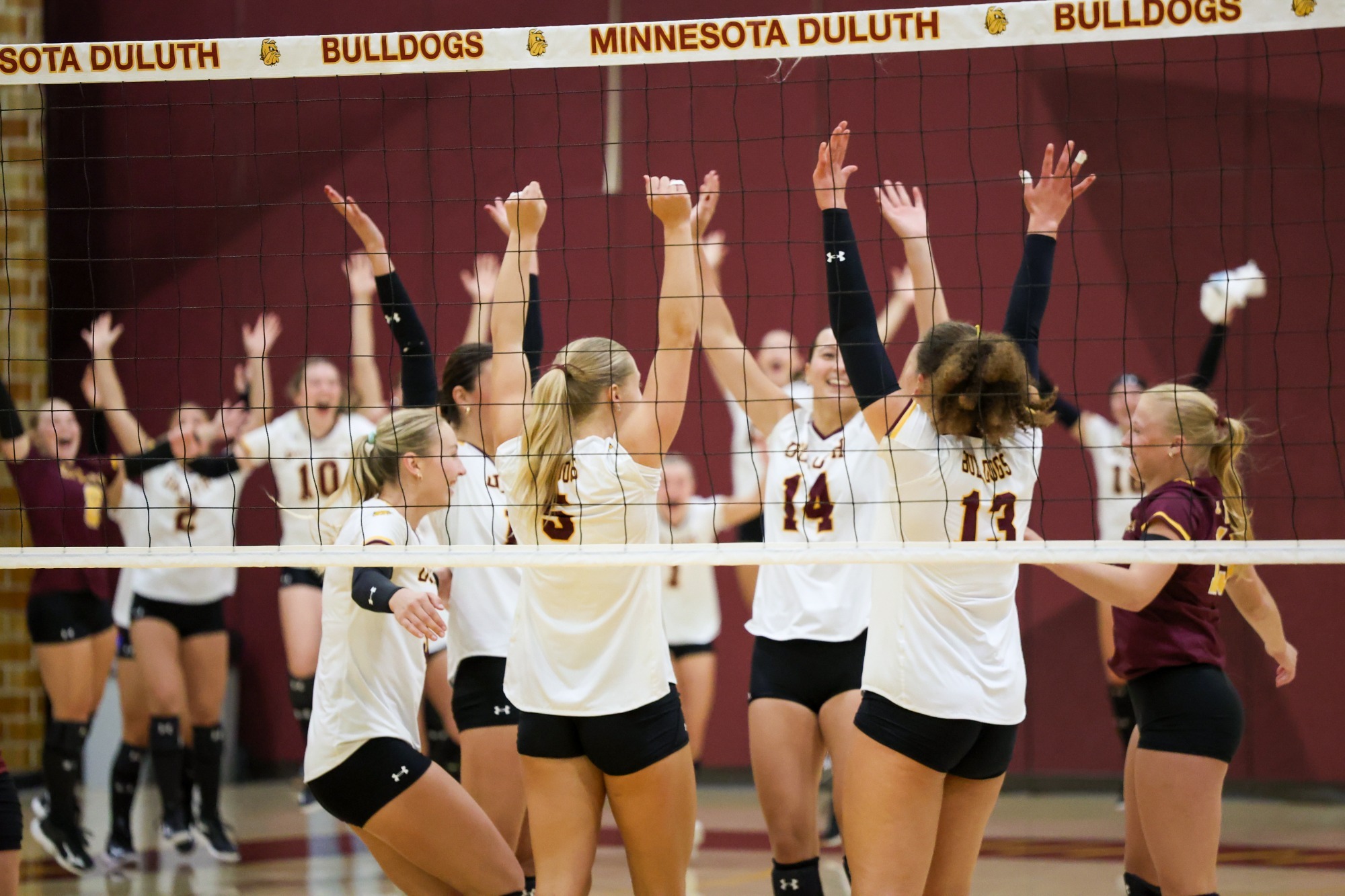 UMD volleyball team celebration