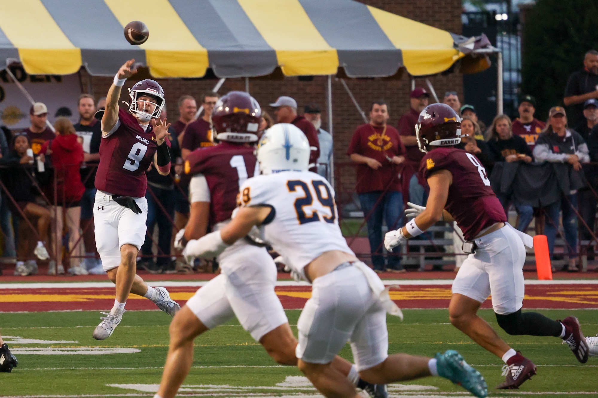 Eggert throwing a pass during the Augustana game.