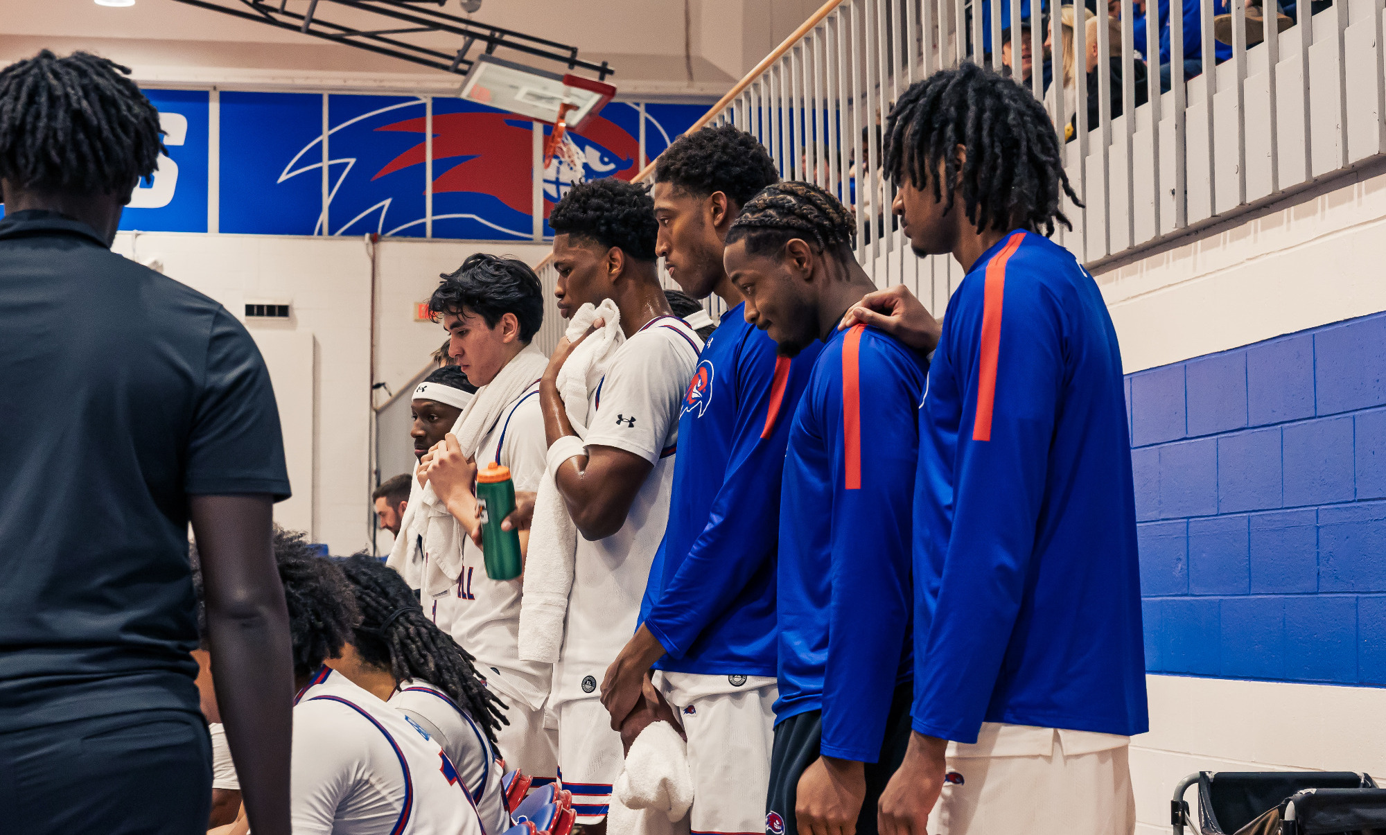 Basketball players behind the bench during timeout