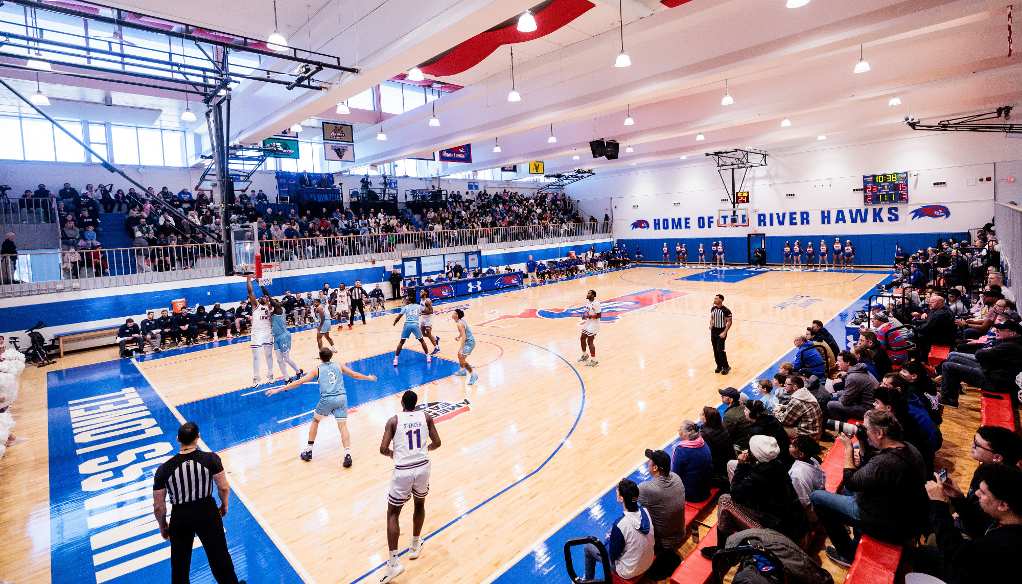 Wide arena shot of Kennedy Family Athletic Complex with Basketball Players on the court