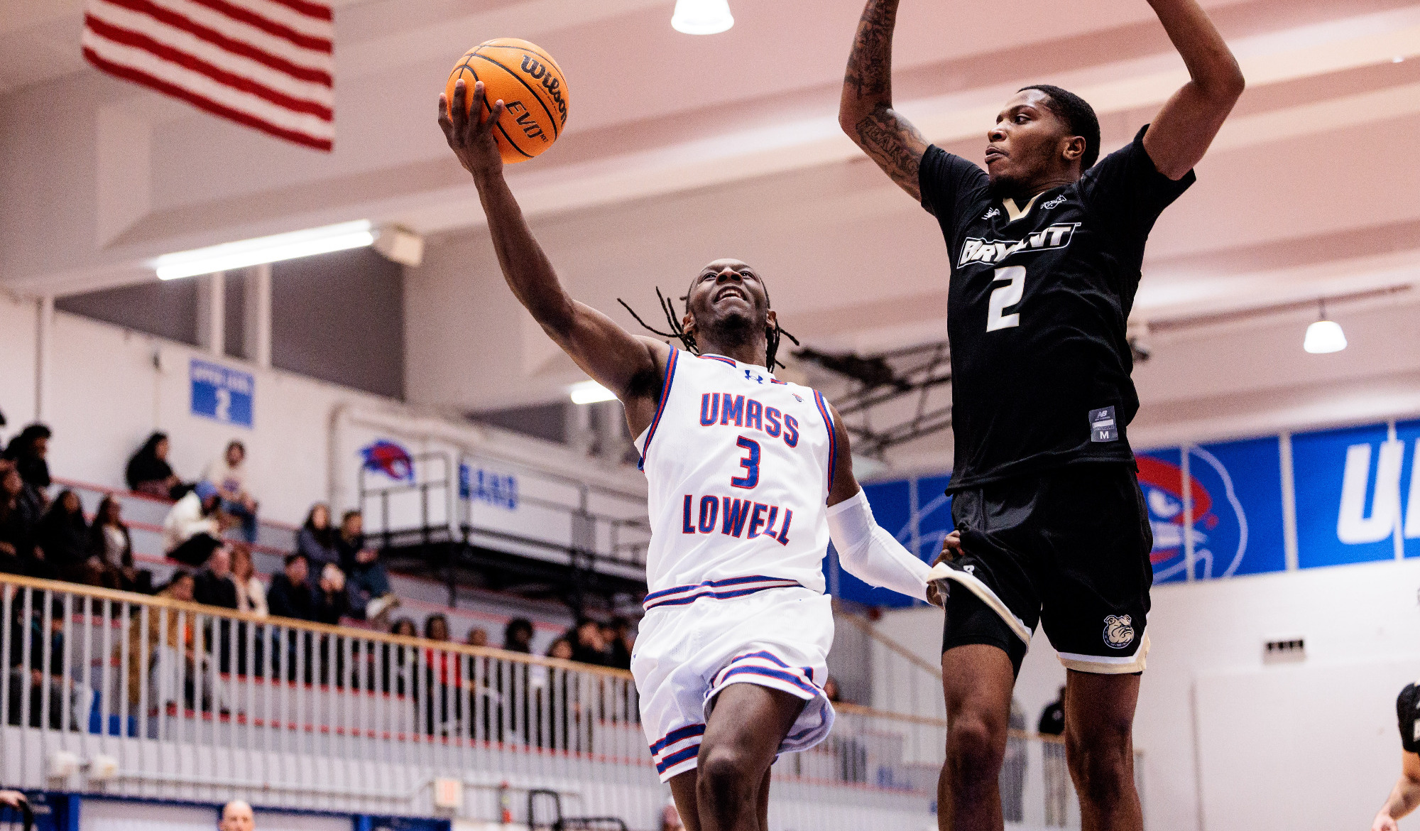 Darrel Yepdo jumping for a layup against Bryant