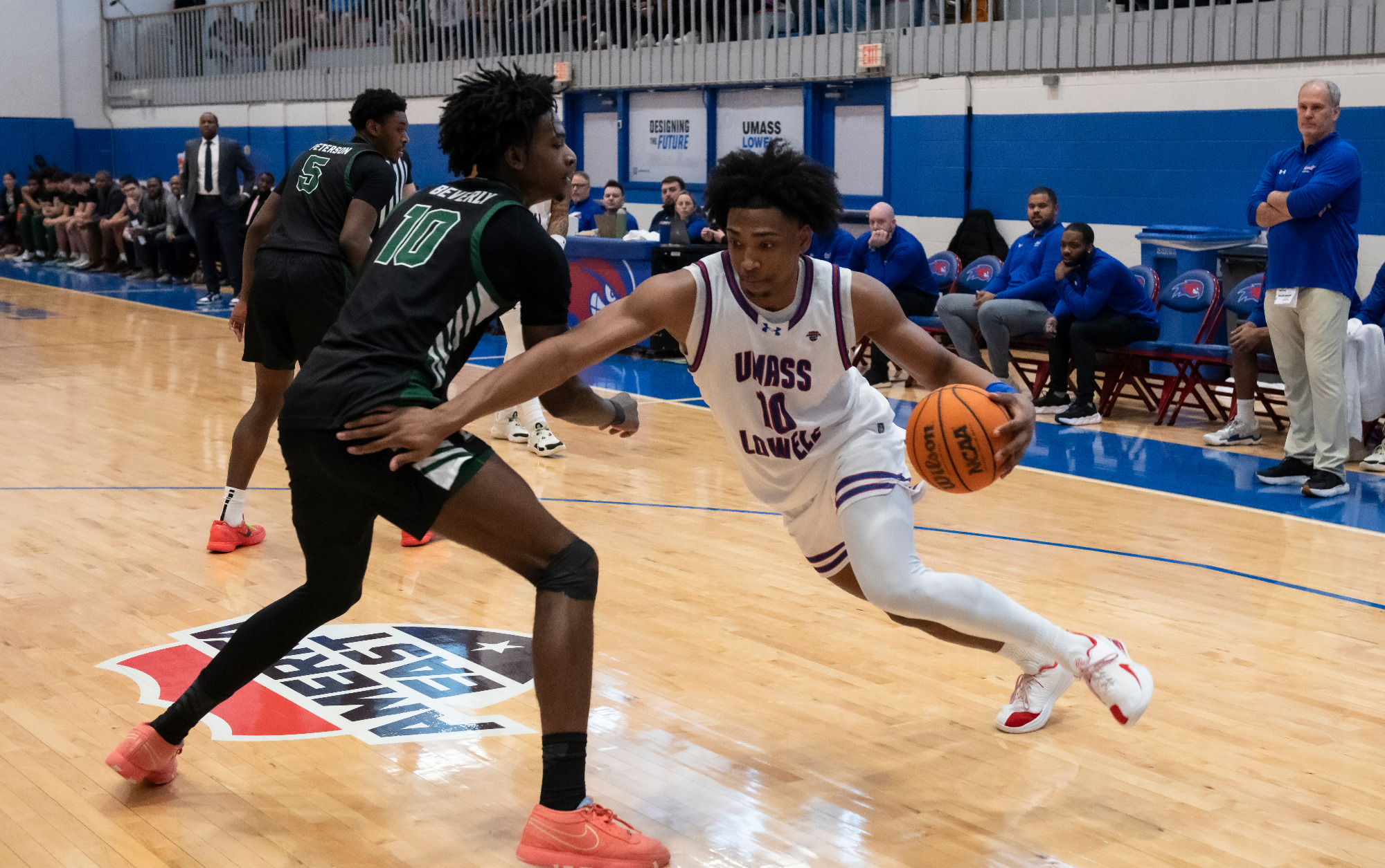 Austin Green driving past Binghamton defender