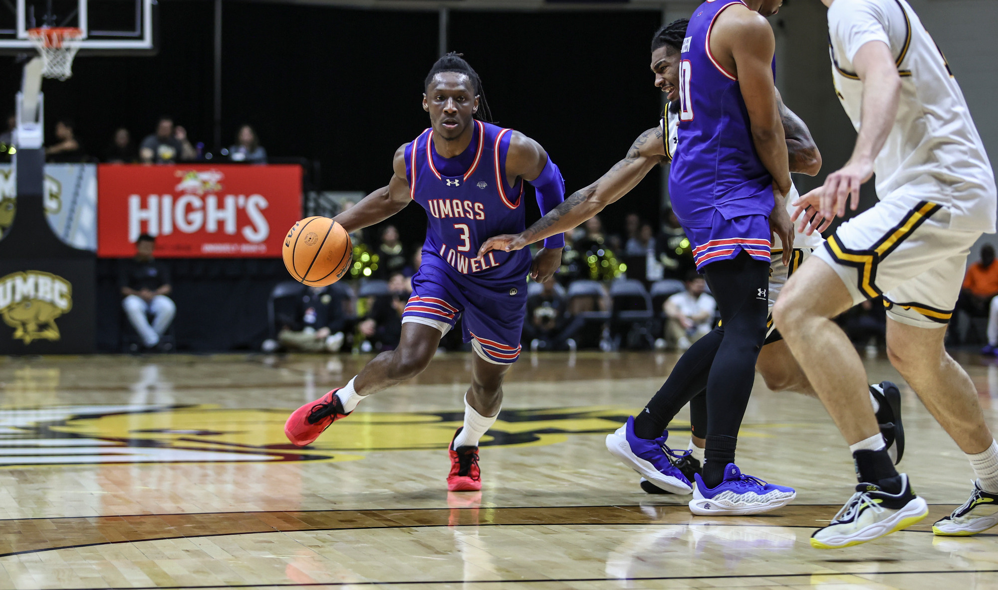 Darrel Yepdo dribbling around a defender at UMBC
