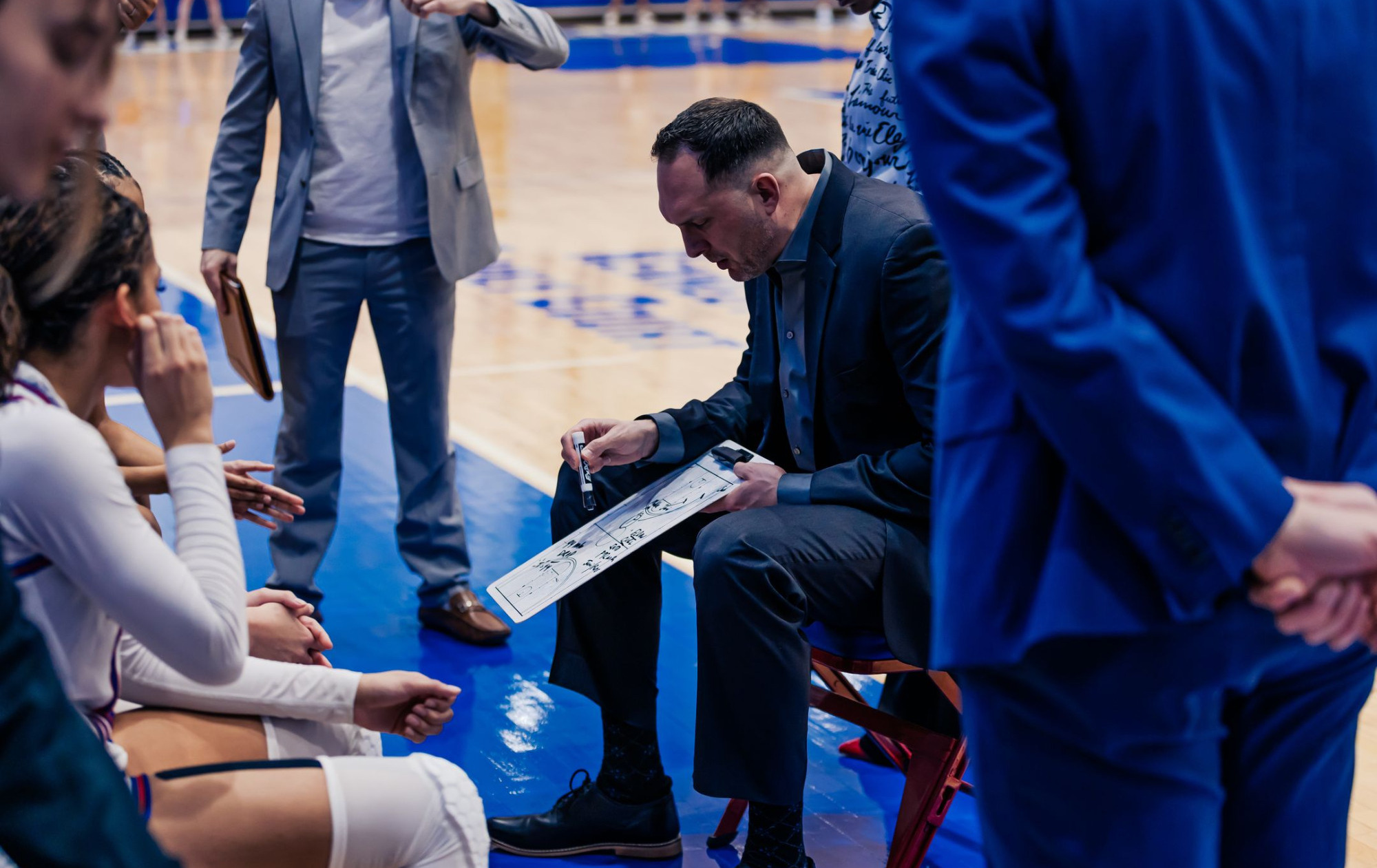 Jon Plefka drawing up a play during a timeouts