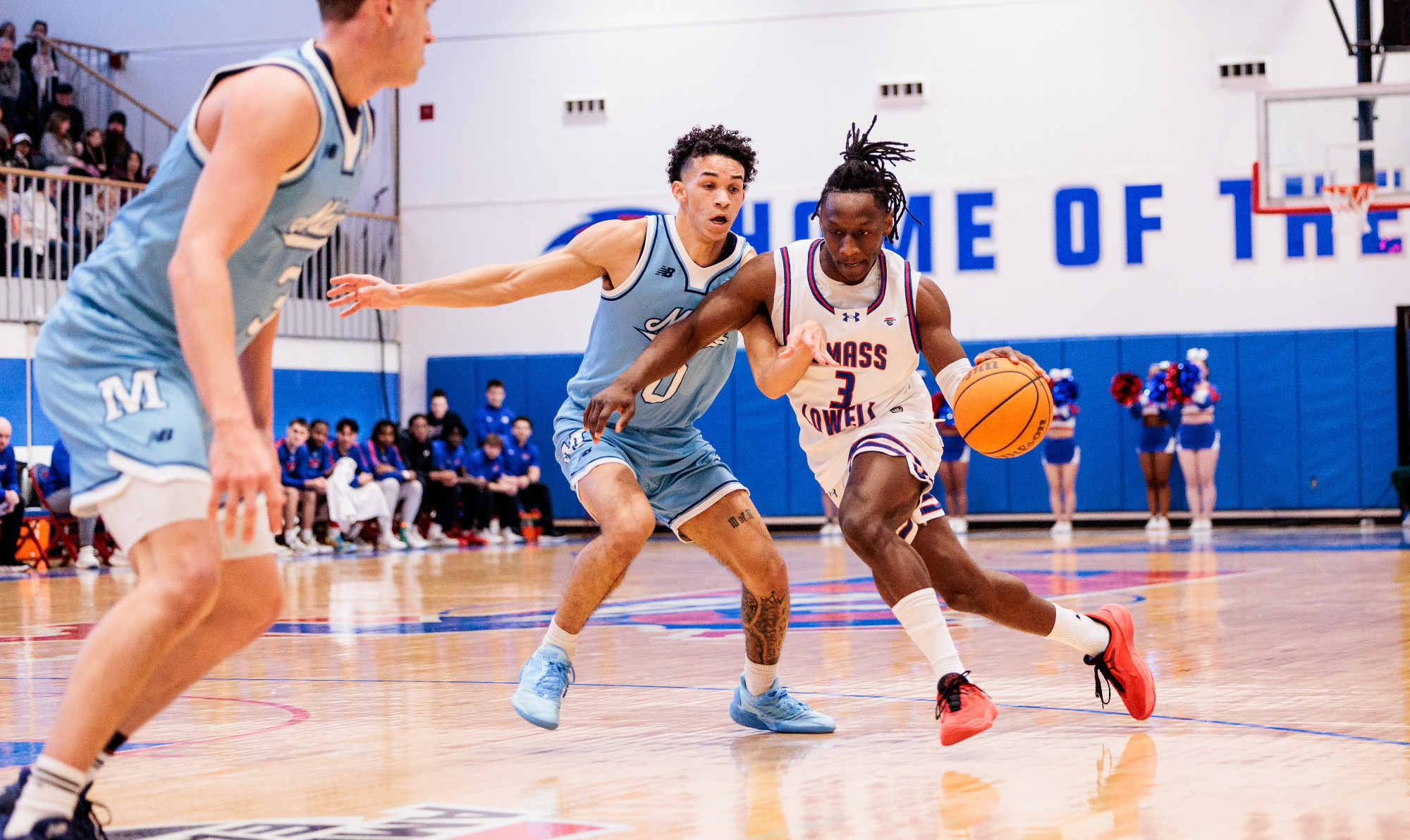 Darrel Yepdo dribbling against a Maine defender