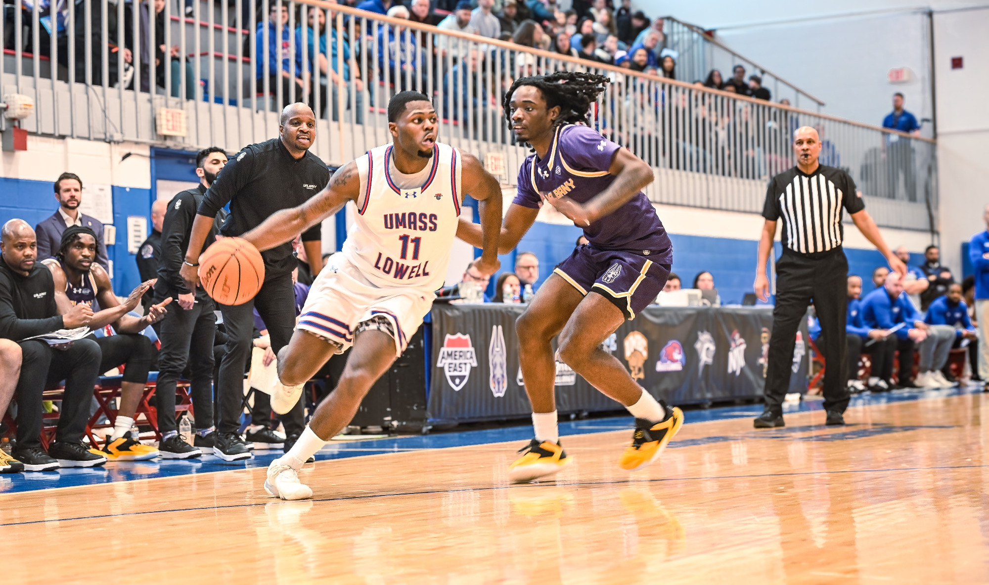 Xavier Spencer dribbling past Albany defender