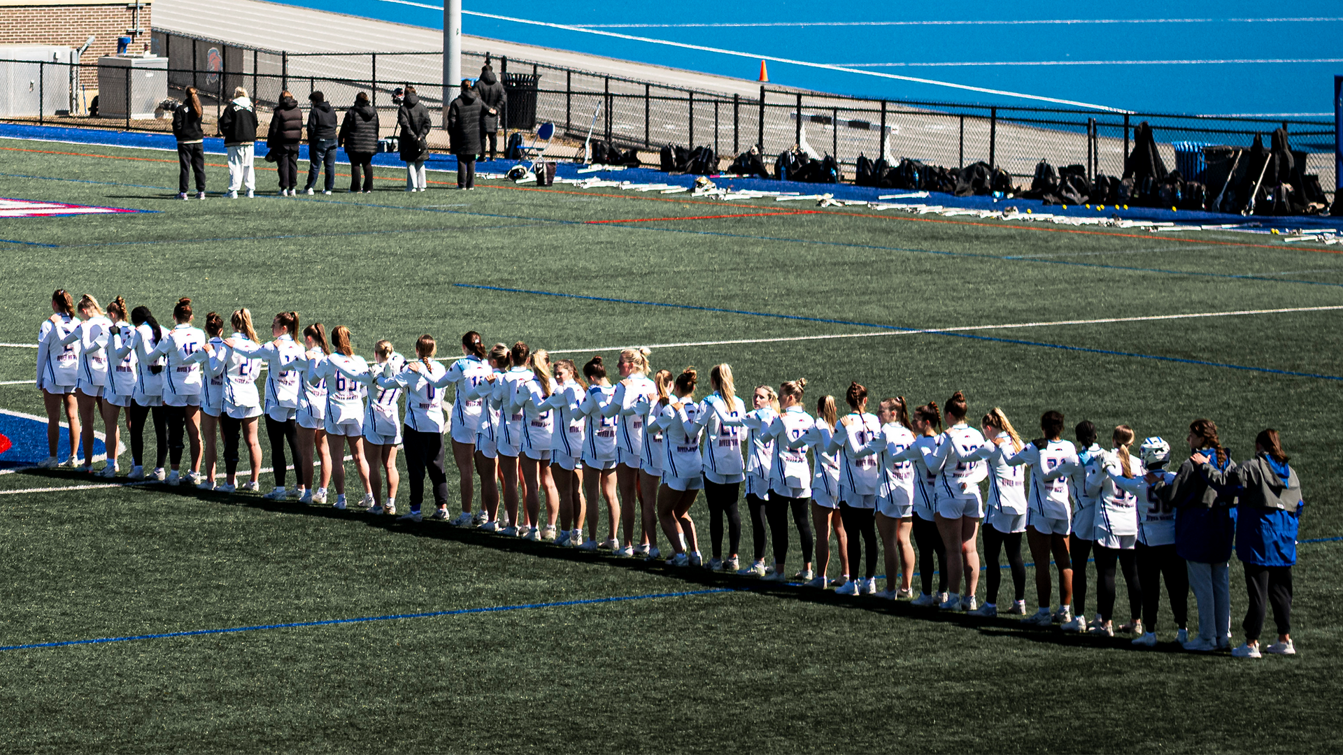 Women's lacrosse lined up for National Anthem before Bryant game