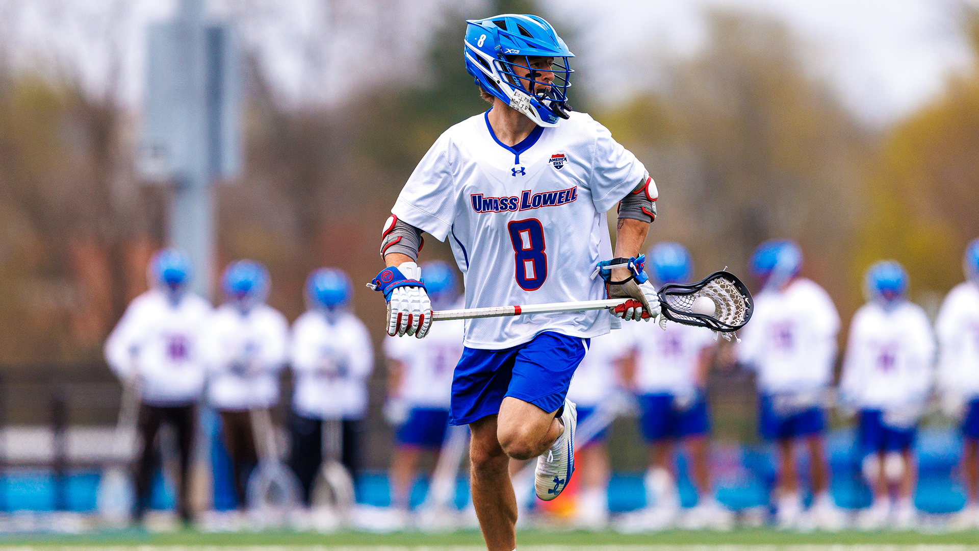 Men's Lacrosse's James Donnelly Running with Ball in Stick Against Vermont