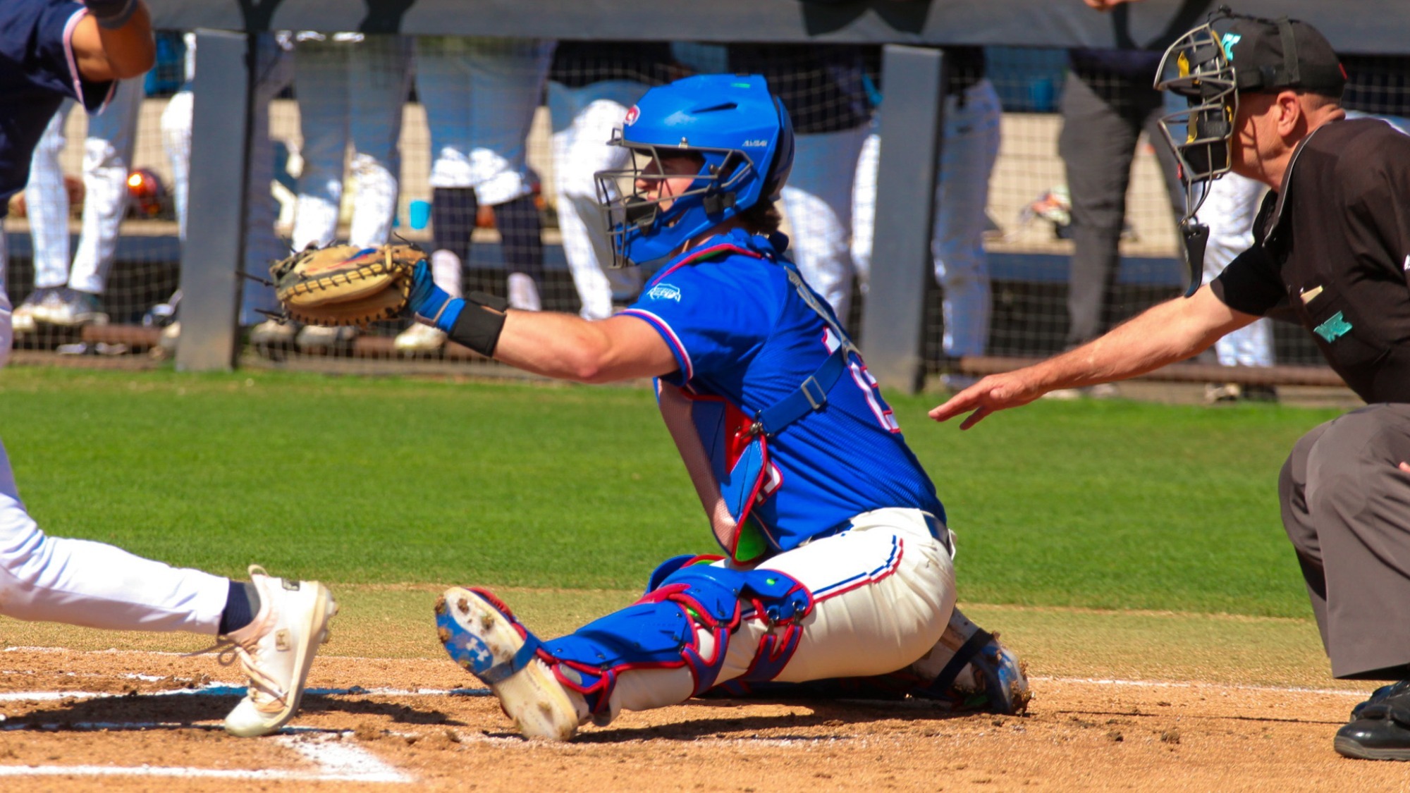 UMass Lowell baseball catcher behind the plate catching the pitchers throws 