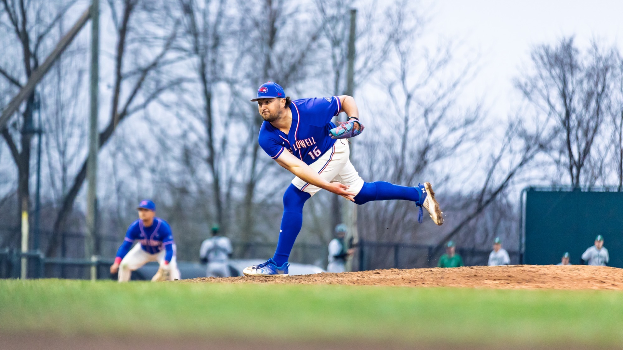 UMass Lowell baseball pitcher tossing the ball on the mound down the strike zone with lots of power