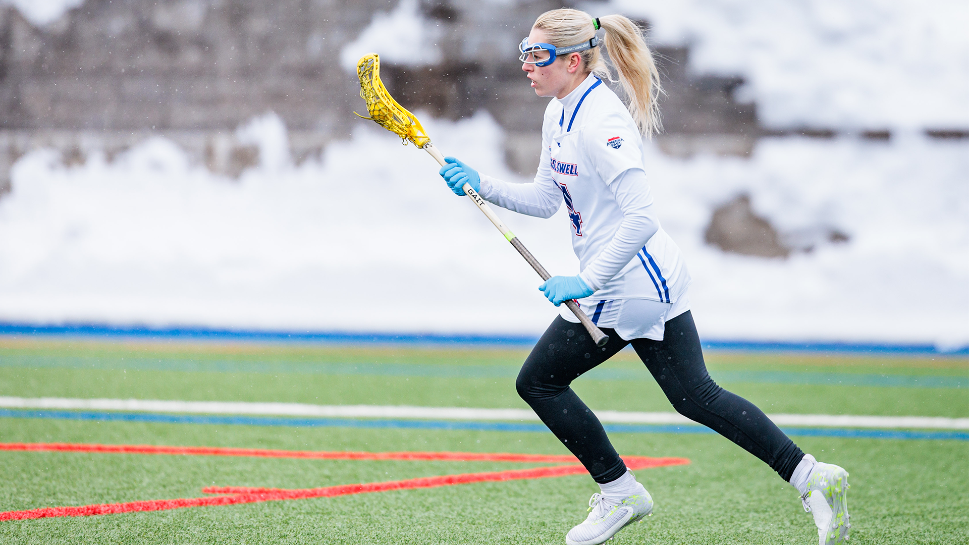 Kaitlynn Anderson with ball in stick 
