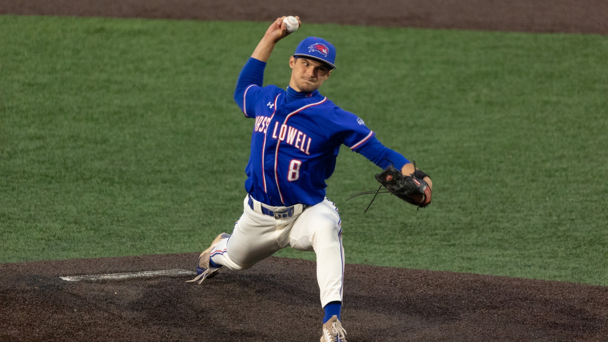 UMass Lowell baseball pitcher on the mound about to throw a pitch down the strike zone to a batter