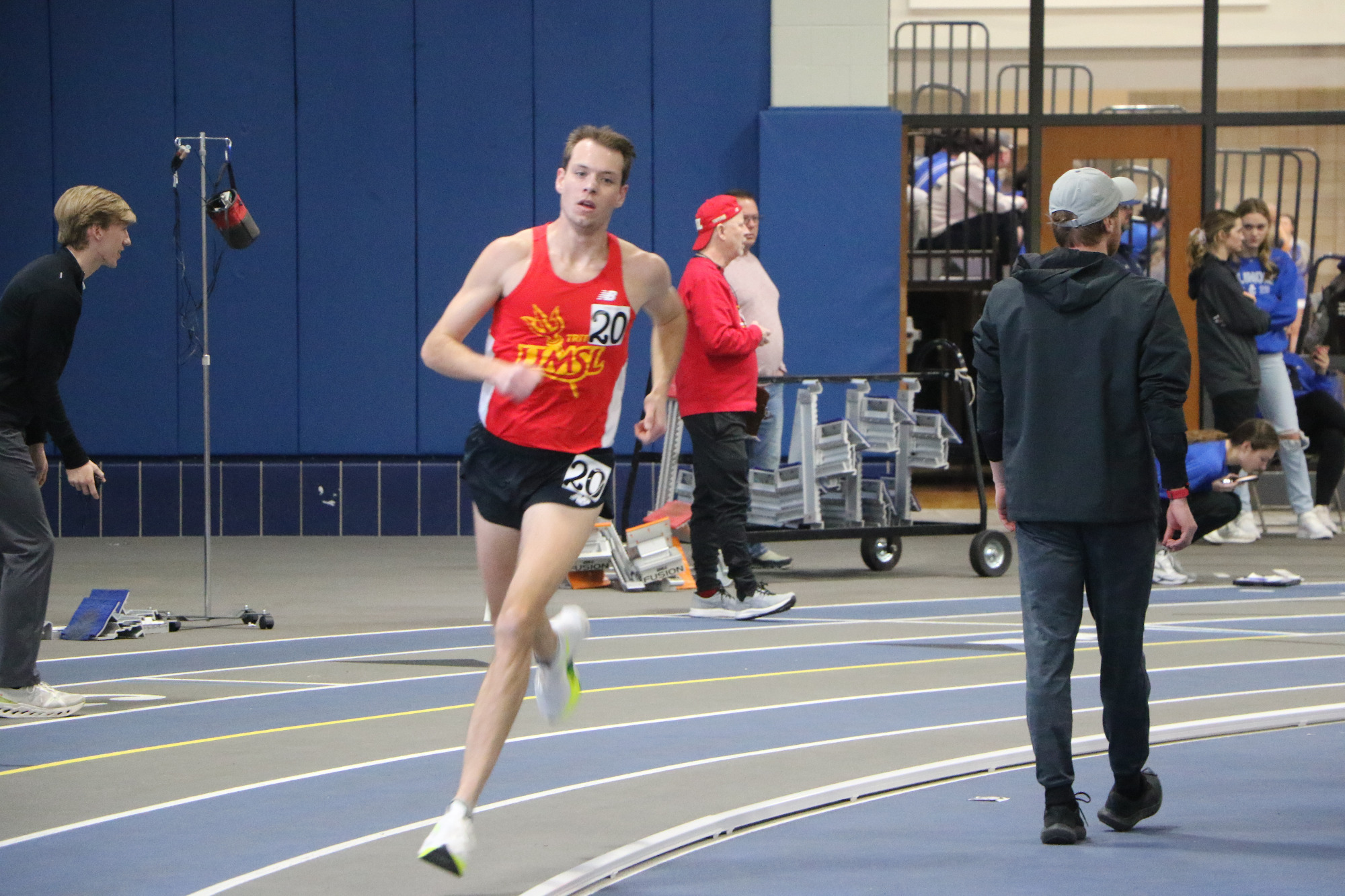 Benjamin VandenBrink runs a lap in the 3,000 meter run