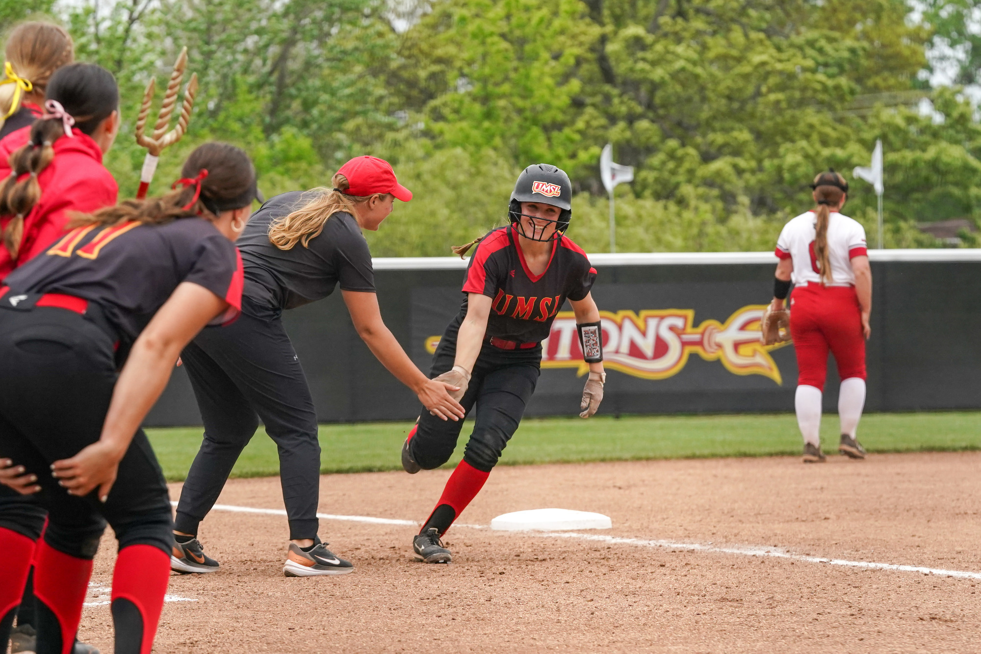 Gwyn Miller rounds third after hitting a two-run home run 
