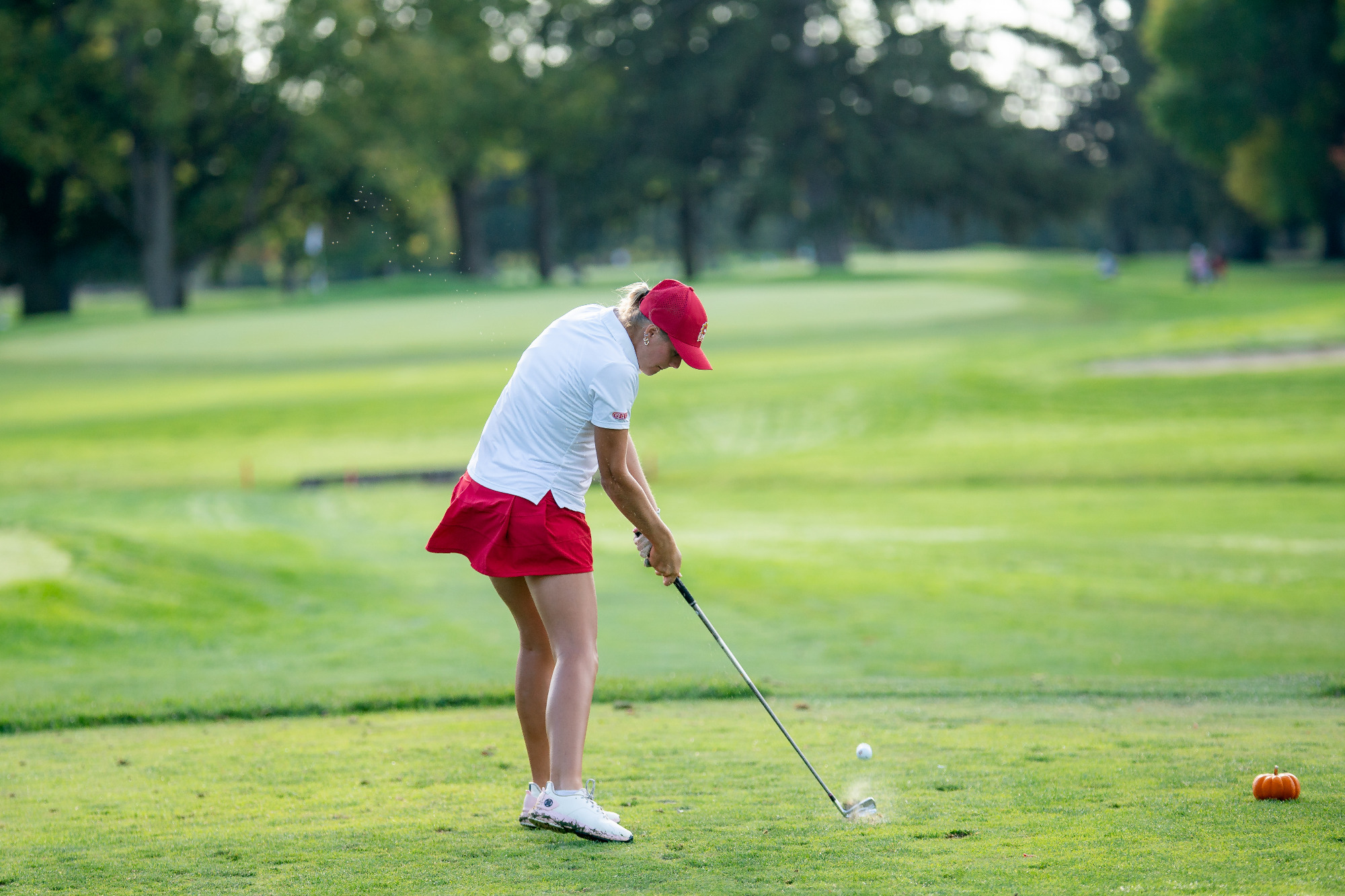 Hillary Currier hits a drive off the tee