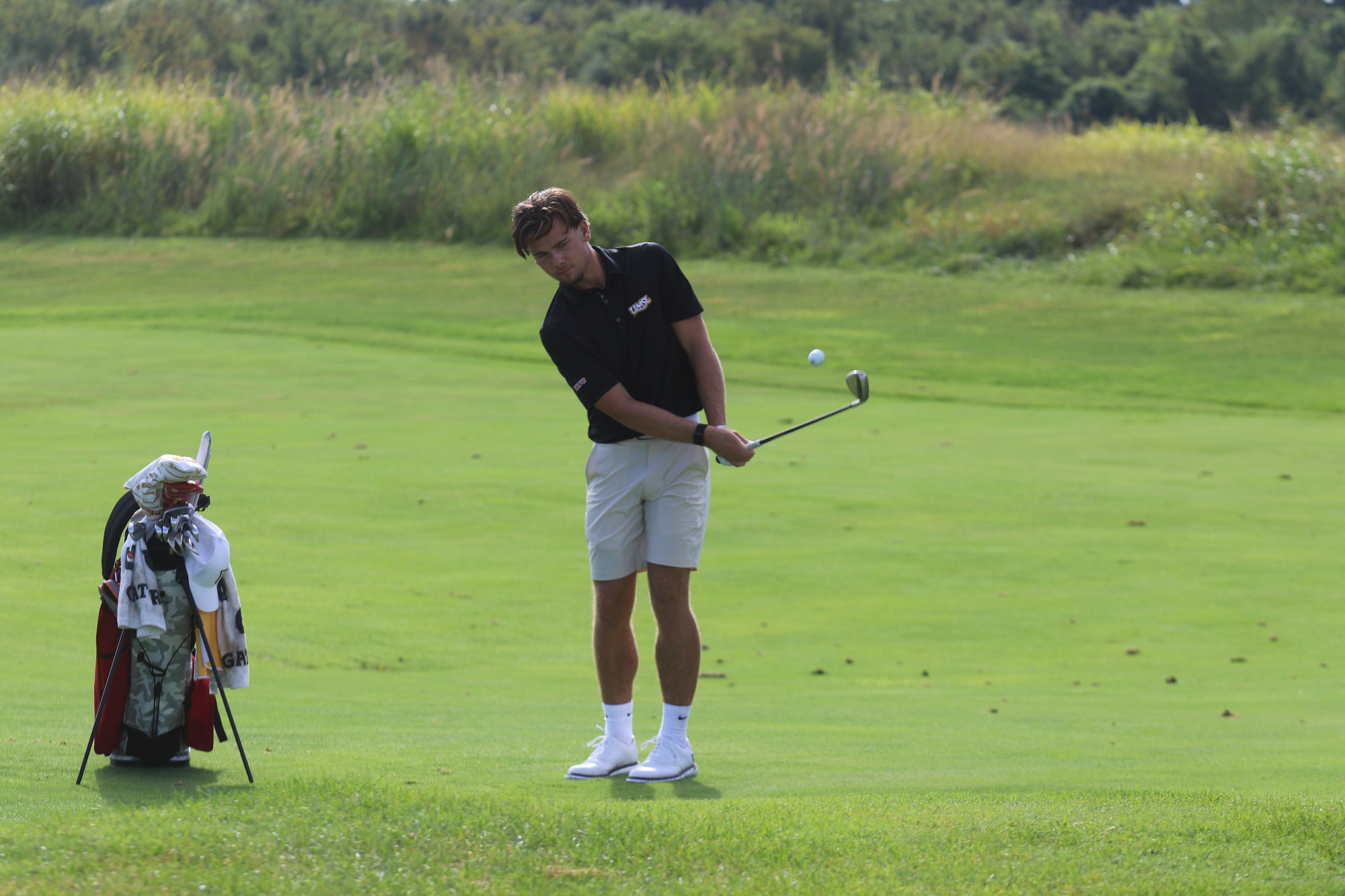 Ludvig Granlund chips the ball onto the green