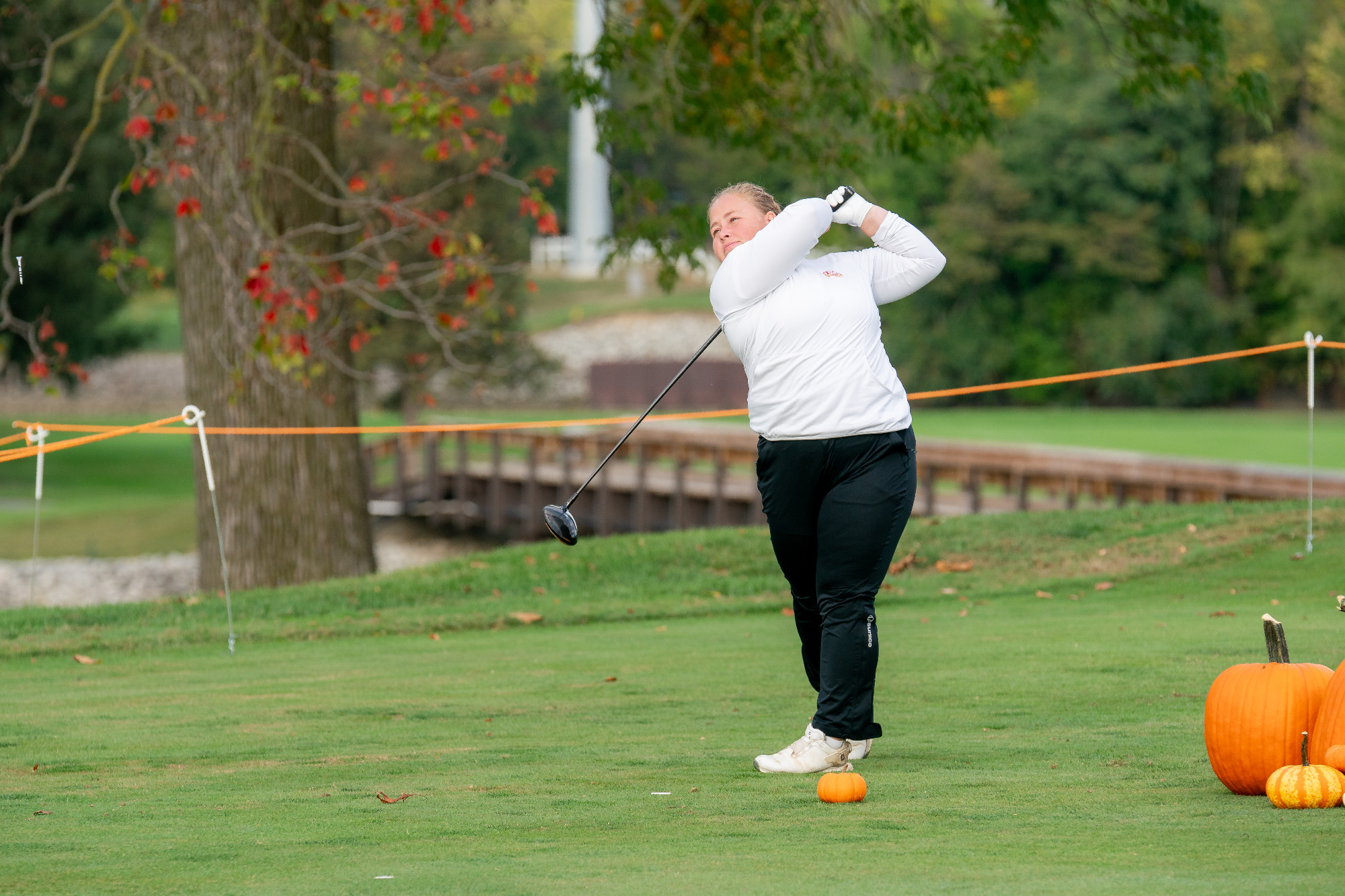 Wilma Zanderau watches her tee shot at the Beall Fall Classic